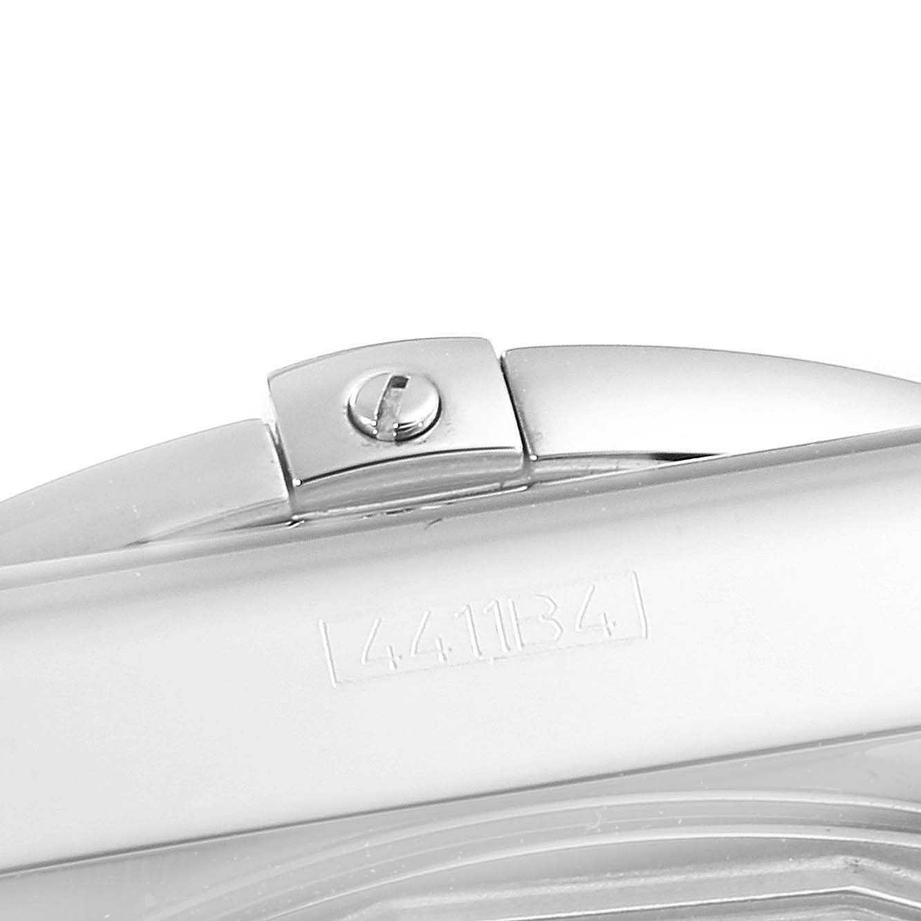 This image shows a close-up view of part of the case and hinge of a Breitling Chronomat AB0110 Men's Stainless Steel Black Dial AB0110 Men's Stainless Steel Black Dial watch, including a visible serial number.