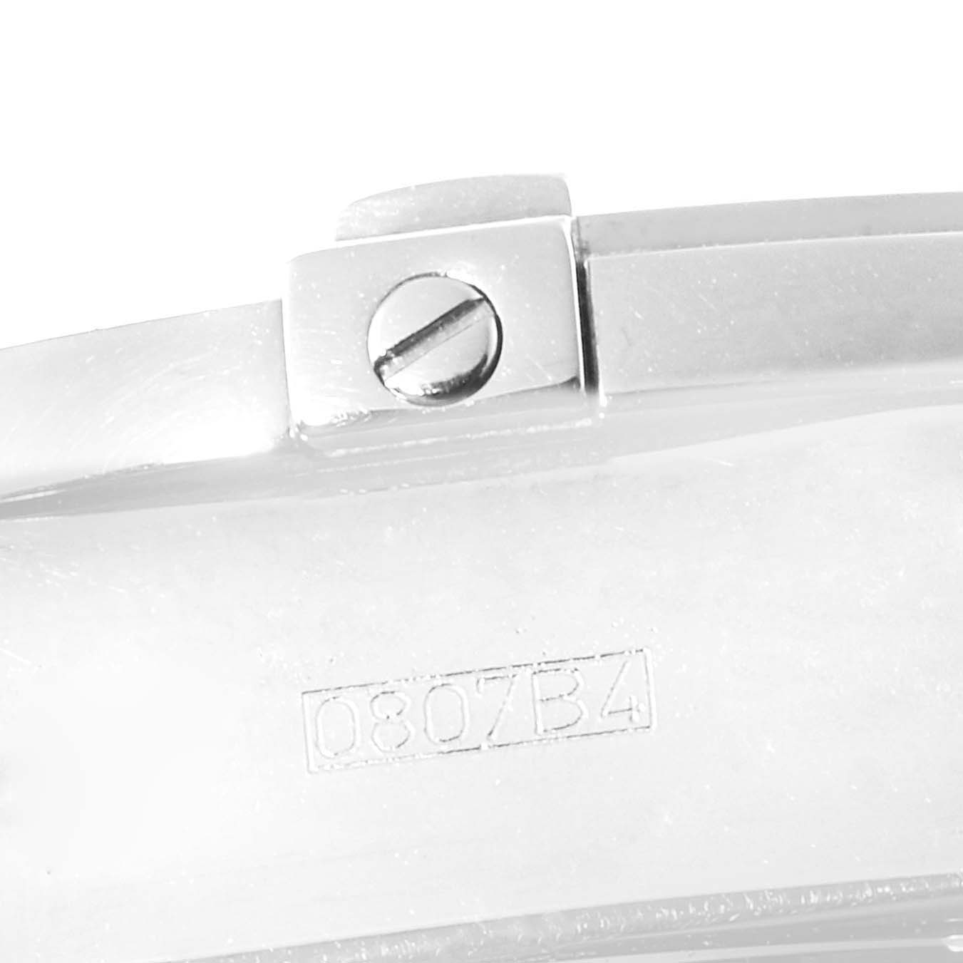 This close-up image of a Breitling Chronomat A13356 Men's Stainless Steel Grey Dial A13356 Men's Stainless Steel Grey Dial watch shows a portion of the bracelet with a visible screw and serial number.