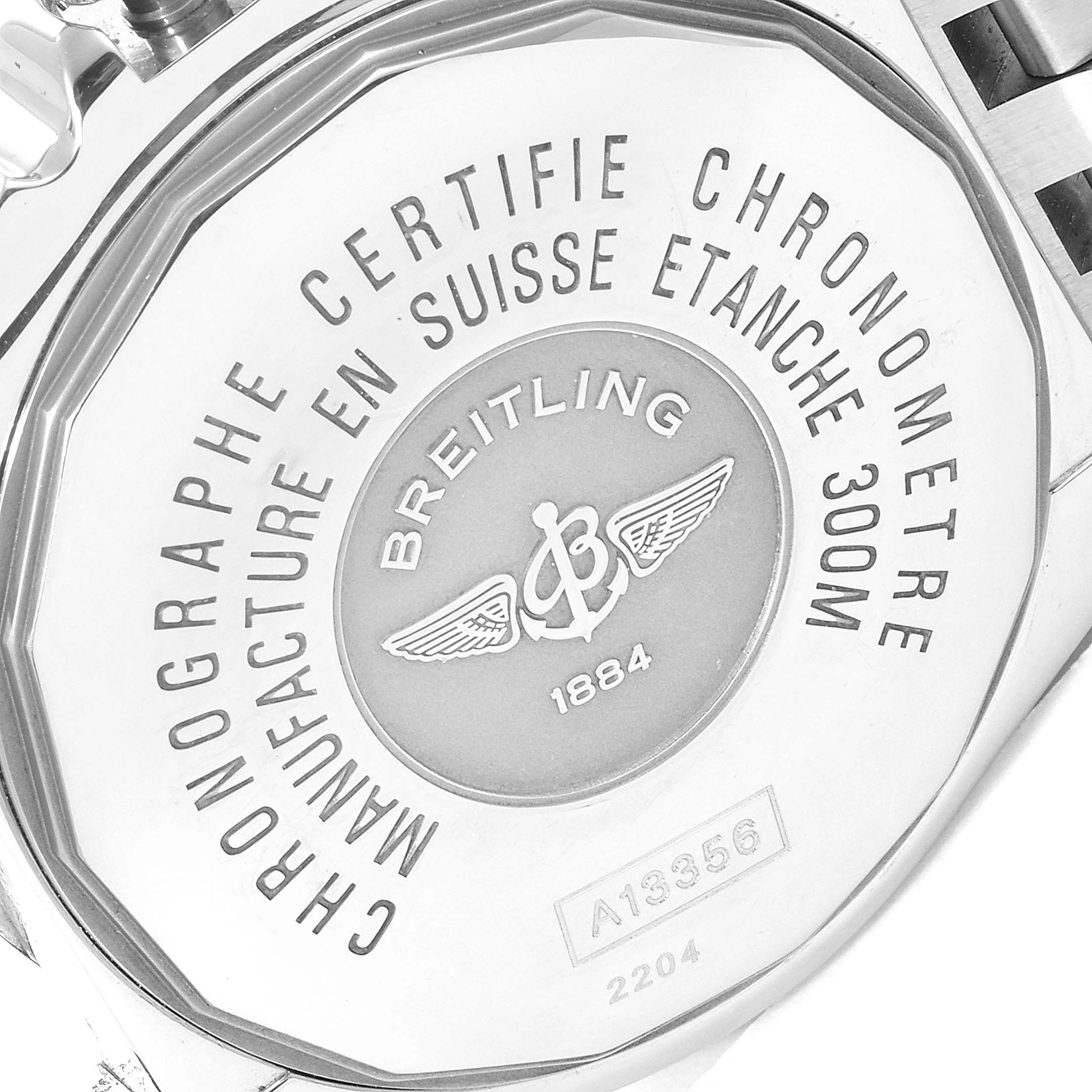 The image shows the case back of a Breitling Chronomat A13356 Men's Stainless Steel Grey Dial A13356 Men's Stainless Steel Grey Dial watch, highlighting its engravings and brand logo.