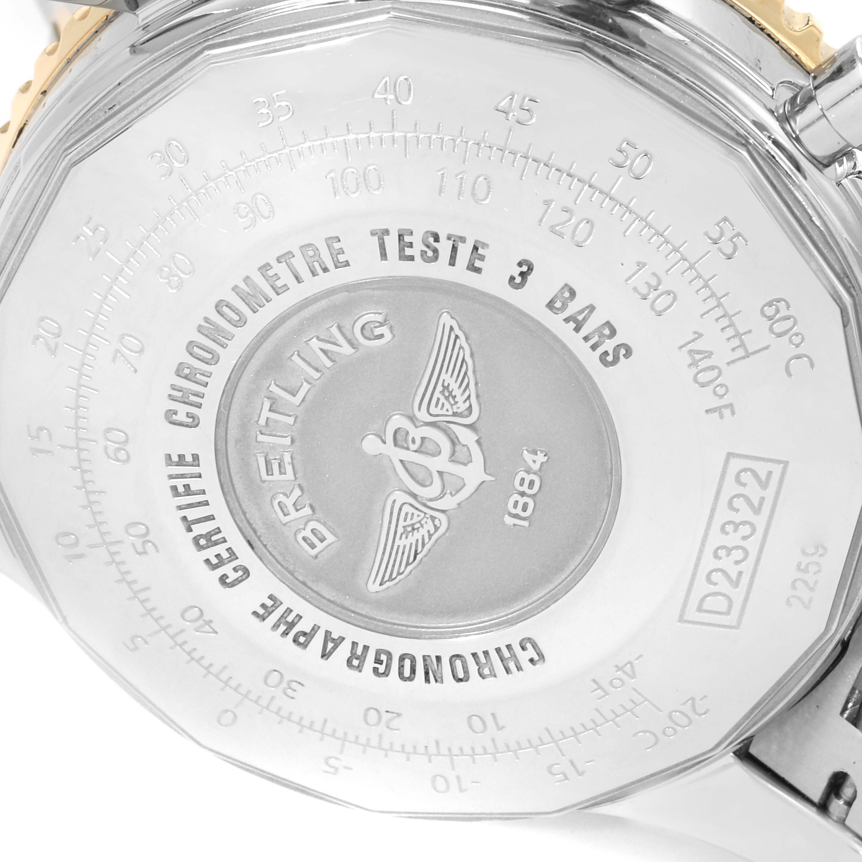 The image shows the case back of a Breitling Navitimer D23322 Men's Steel and Gold (two tone) Blue Dial D23322 Men's Steel and Gold (two tone) Blue Dial watch, featuring engravings and the brand's logo.