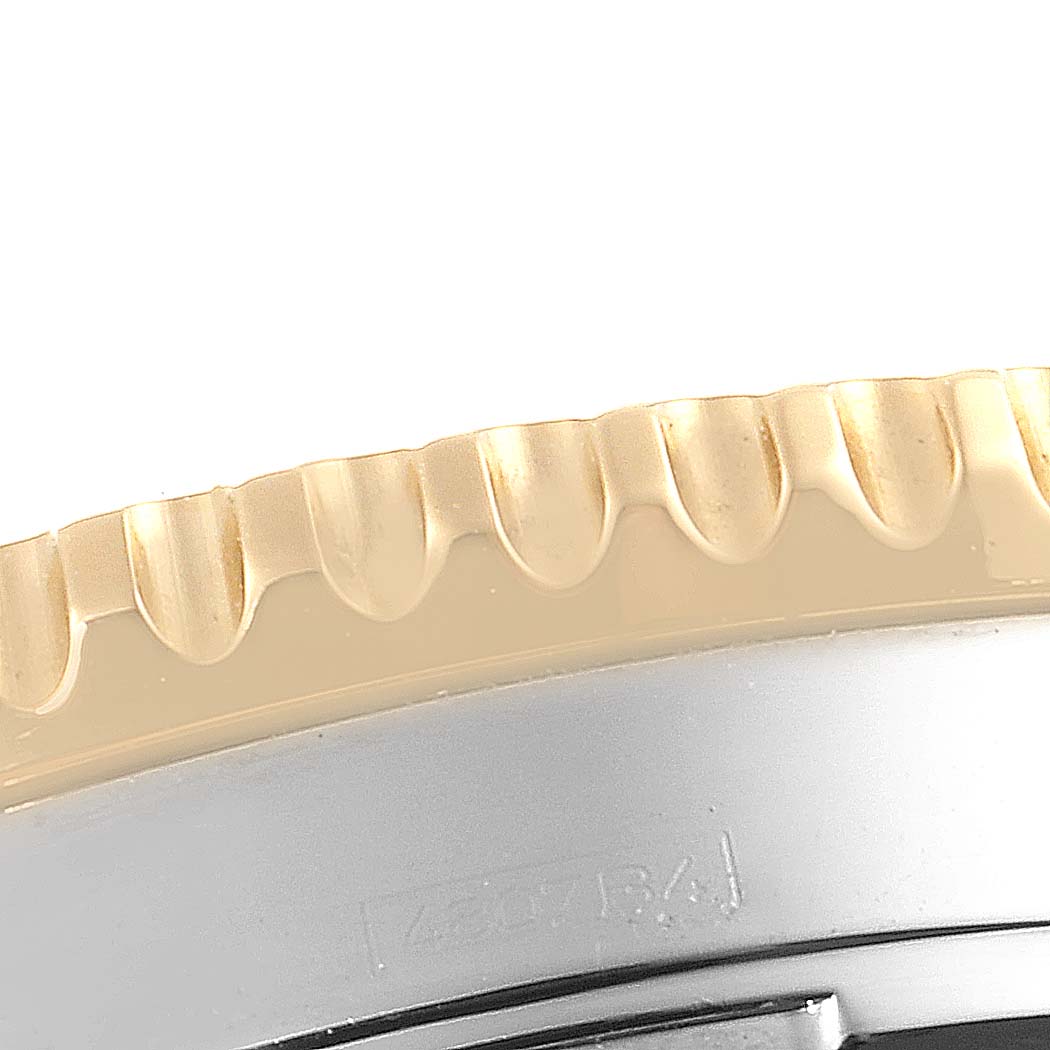 The image shows a close-up of the bezel and case side of a Breitling Navitimer D23322 Men's Steel and Gold (two tone) Blue Dial D23322 Men's Steel and Gold (two tone) Blue Dial watch.