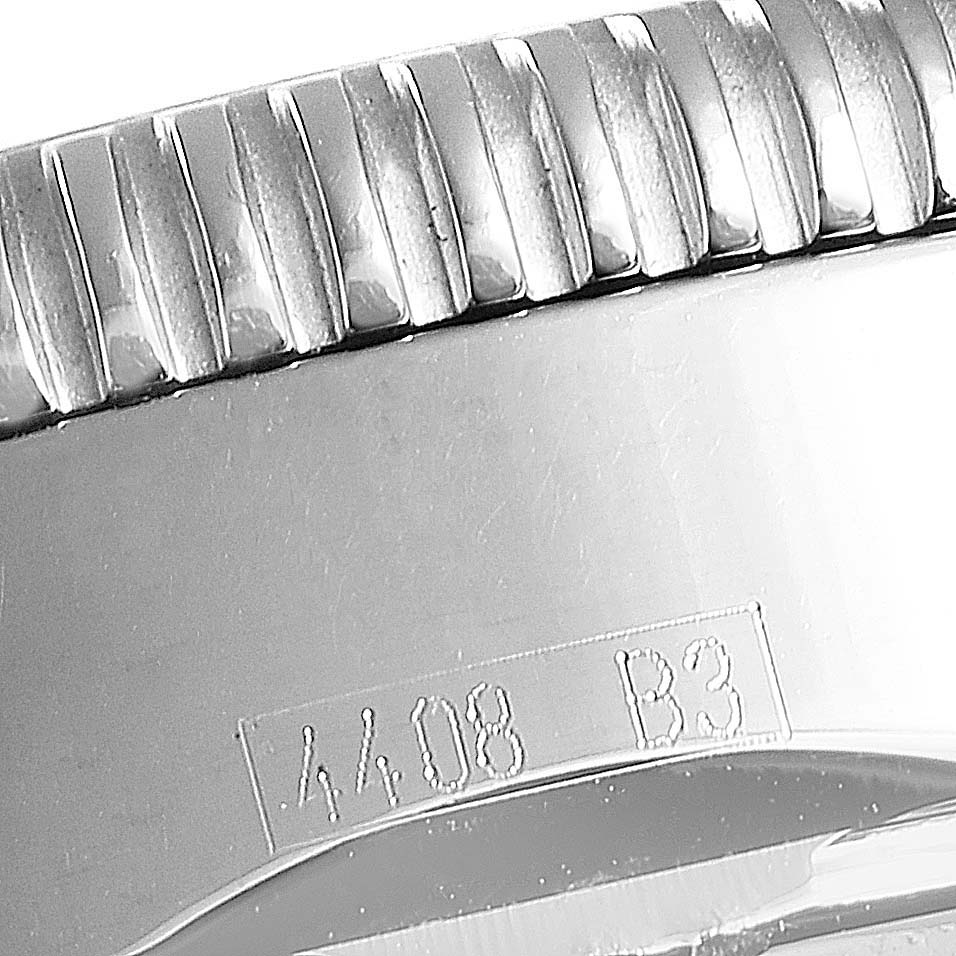 The image shows a close-up angle of the ridged bezel and engraved serial number on the Breitling Superocean A13320 Men
s Stainless Steel Brown Dial A13320 Men
s Stainless Steel Brown Dial watch.