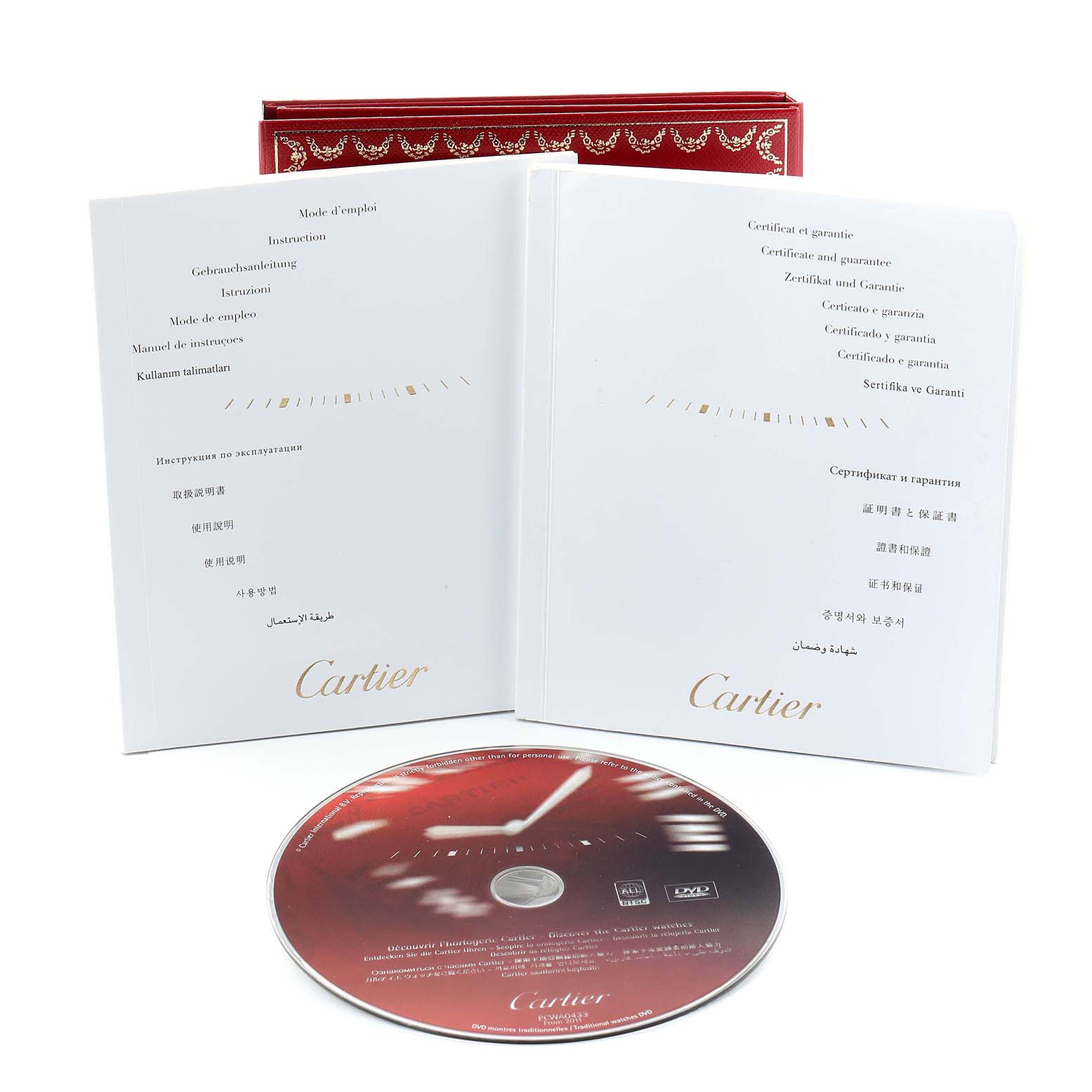 The image shows the Cartier Ballon Bleu W69007Z3 Women's Stainless Steel Silver Dial watch accessories including a red box, manuals, and a DVD.