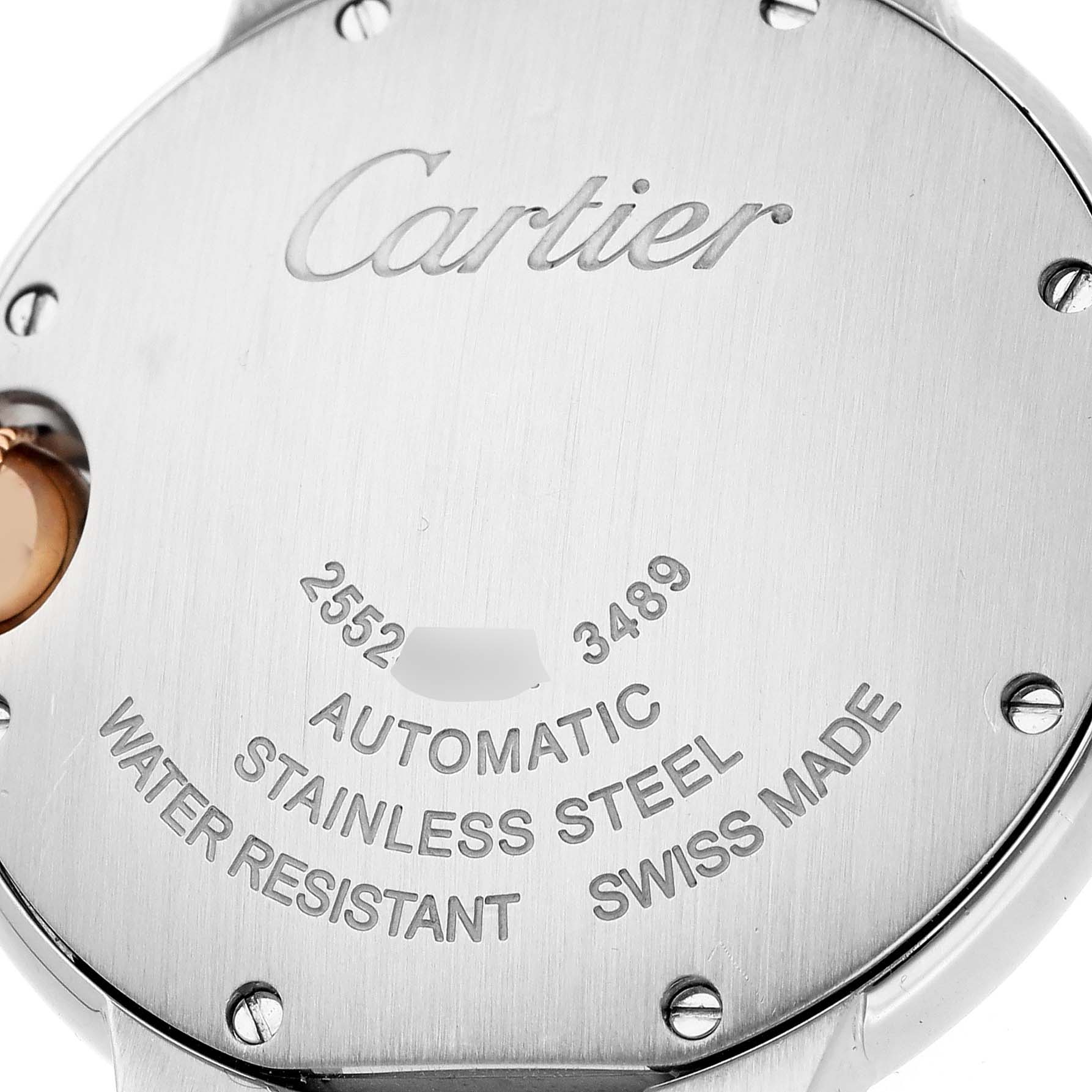 The image shows the case back of a Cartier Ballon Bleu WE902053 Women's Steel and Gold (two tone) Pink Dial watch, featuring the brand name and specifications engraved.