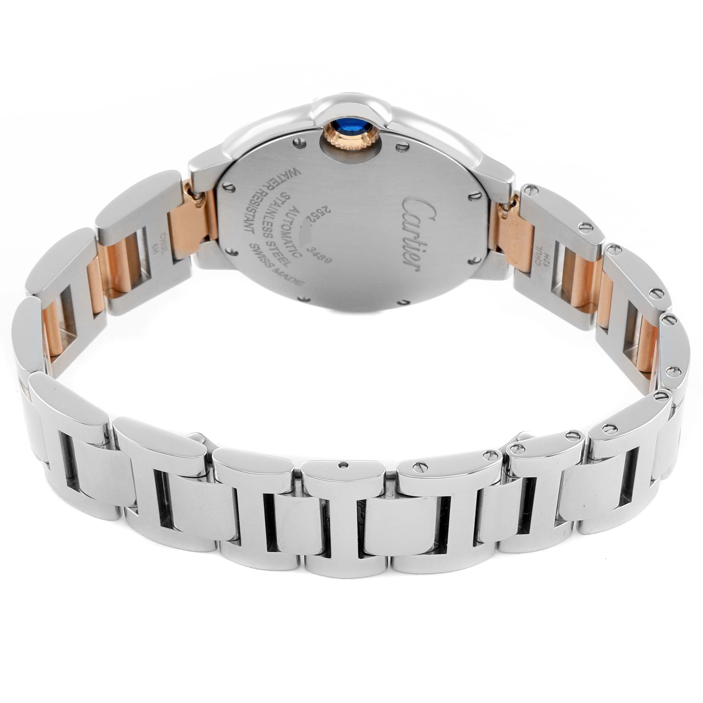 The Cartier Ballon Bleu WE902053 Women's Steel and Gold (two tone) Pink Dial watch is shown from the back, highlighting the case back and two-tone bracelet.