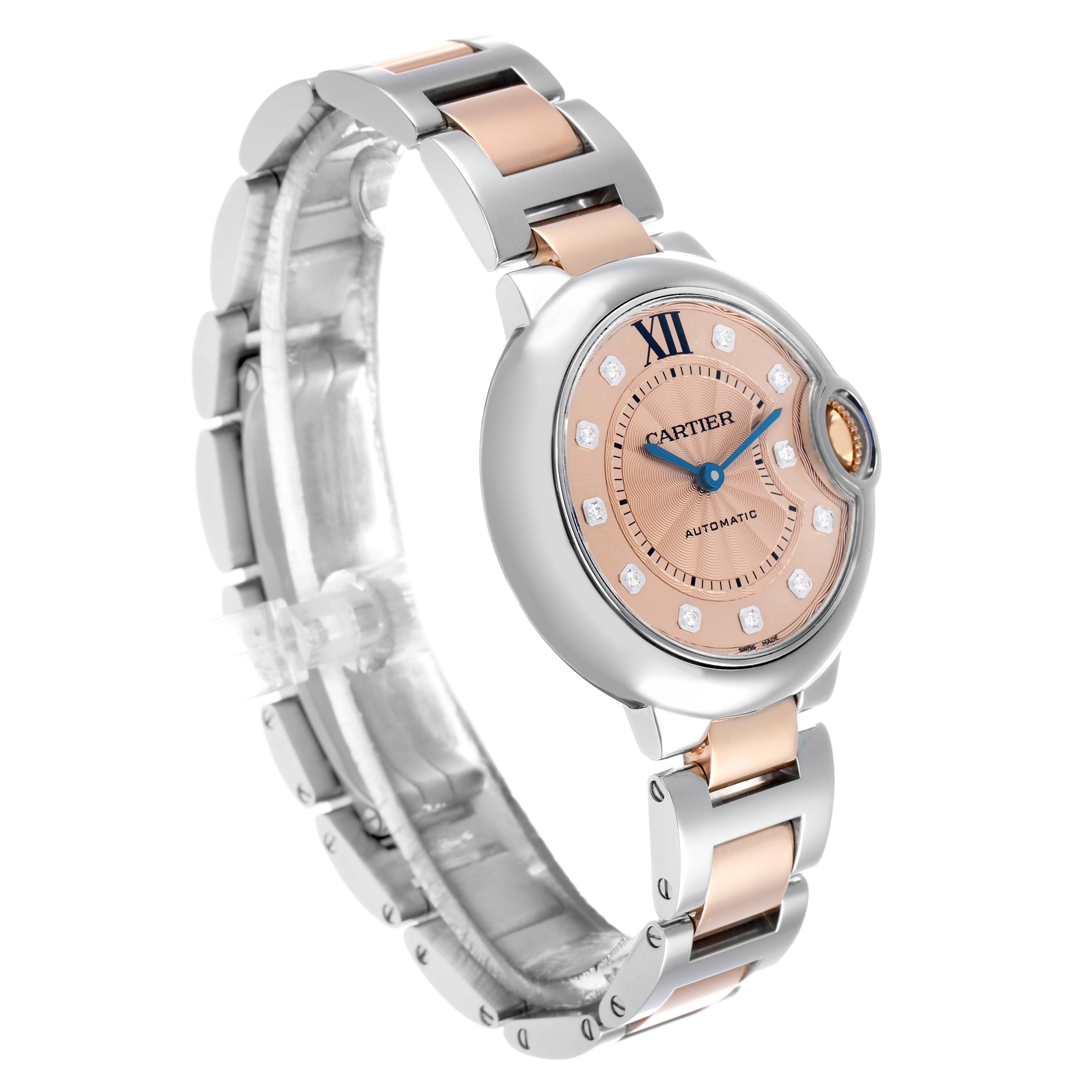 The Cartier Ballon Bleu WE902053 Women's Steel and Gold (two tone) Pink Dial watch is shown at an angled view, highlighting the face, bracelet, and crown.