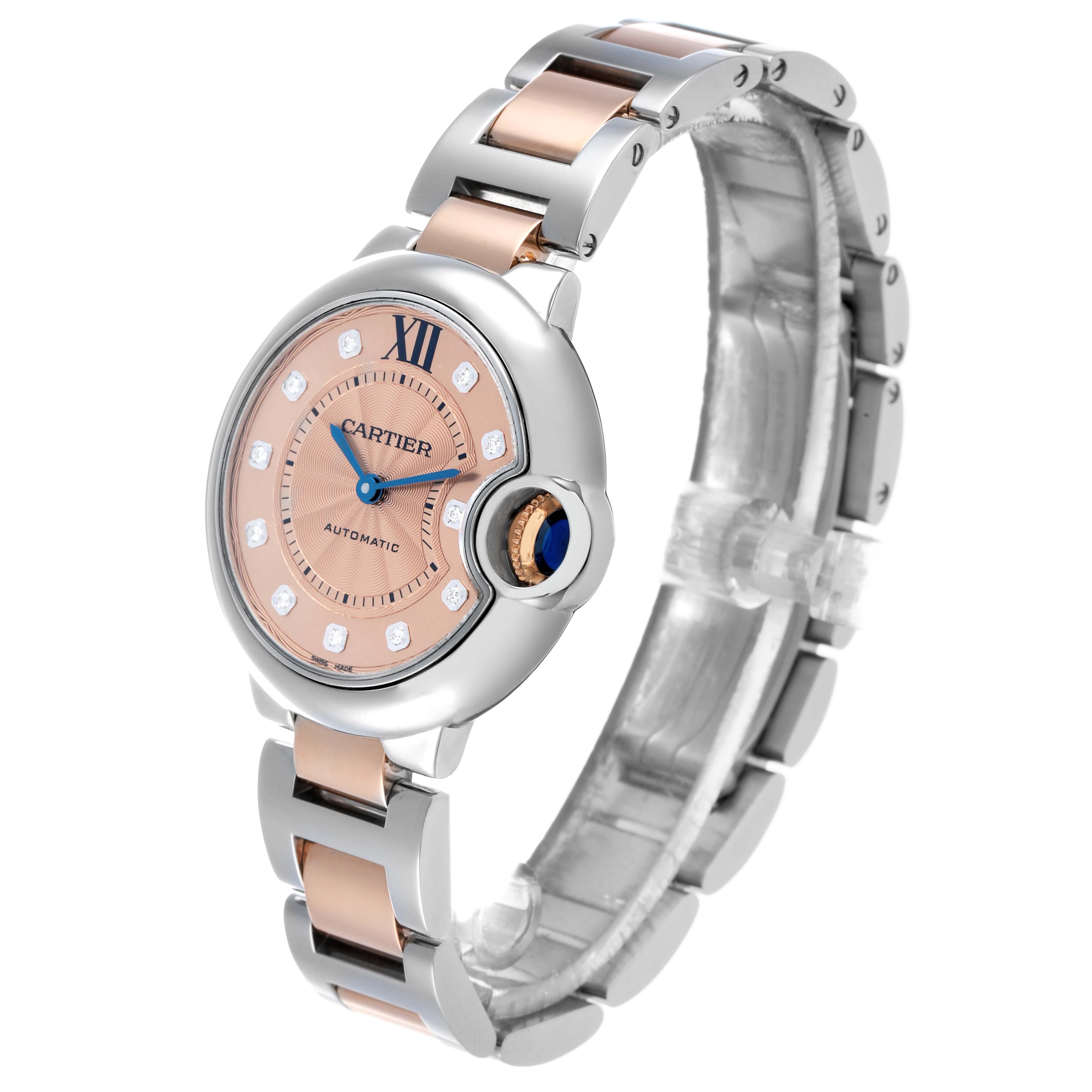 The Ballon Bleu de Cartier watch is shown at a three-quarter angle, highlighting its face, bracelet, and crown.