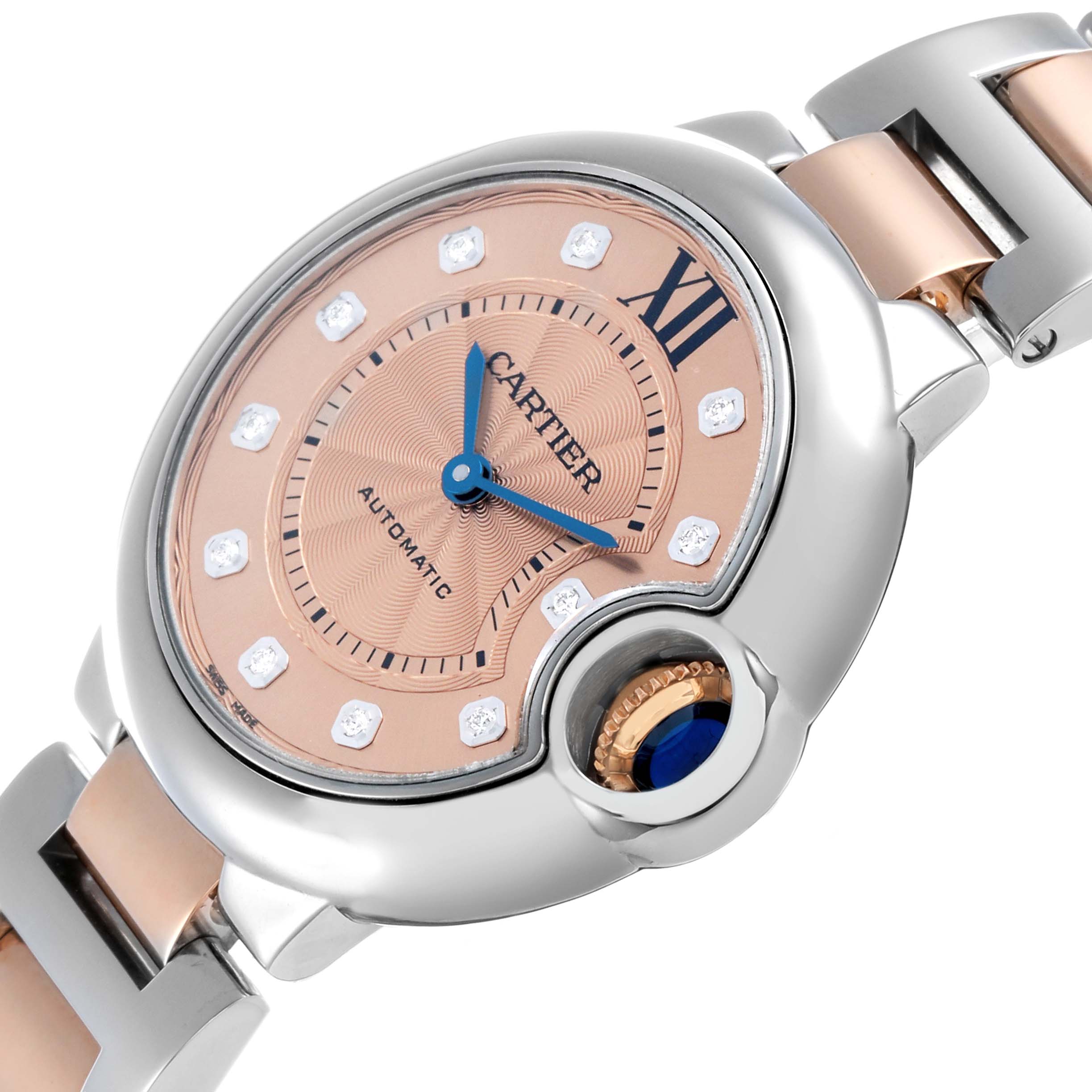 The Cartier Ballon Bleu WE902053 Women's Steel and Gold (two tone) Pink Dial watch is shown at a slight angle, highlighting the face, crown, and part of the strap.