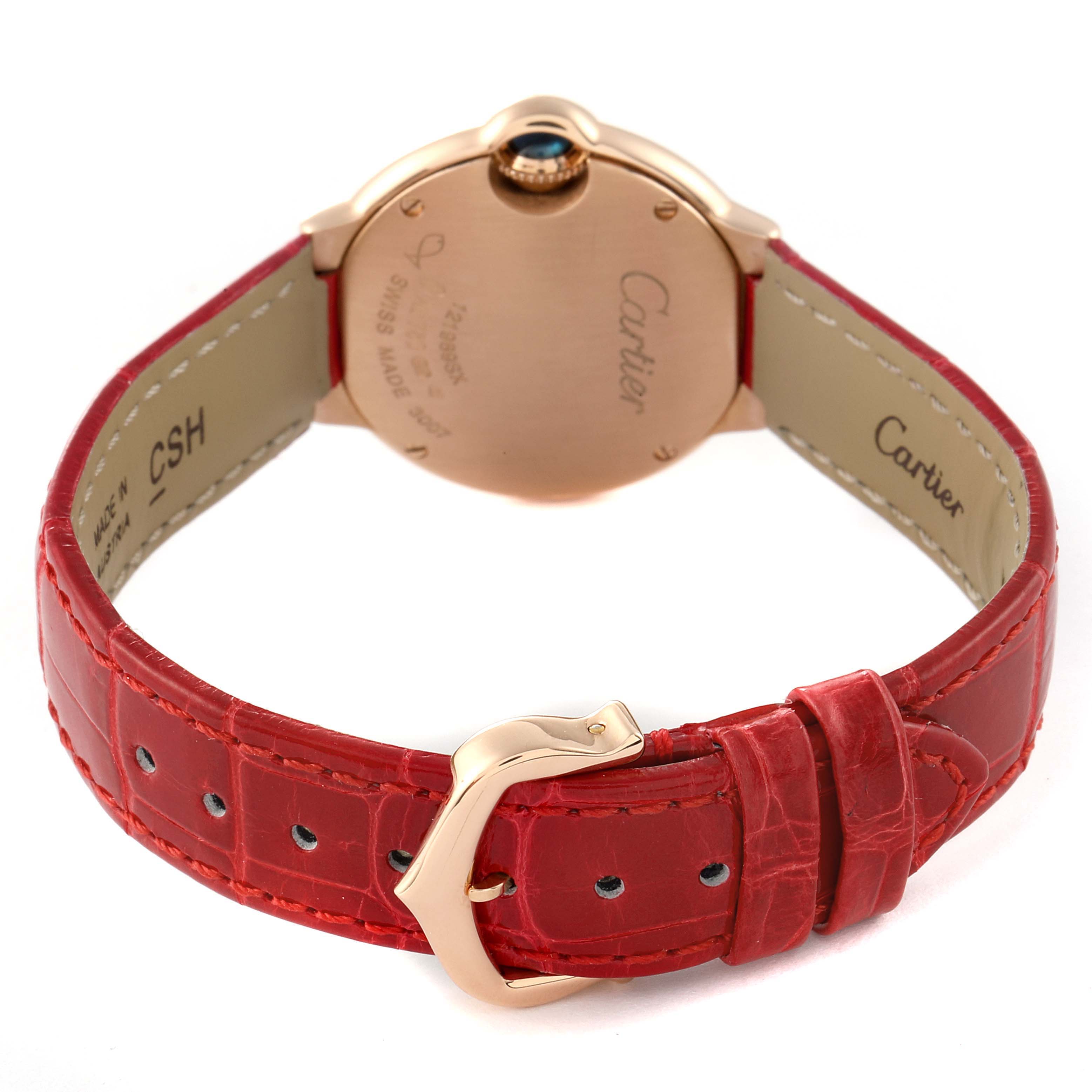 This image shows the back view of a Cartier Ballon Bleu W6900256 Women
s Rose Gold Silver Dial W6900256 Women
s Rose Gold Silver Dial watch, including its case back and red leather strap with buckle.
