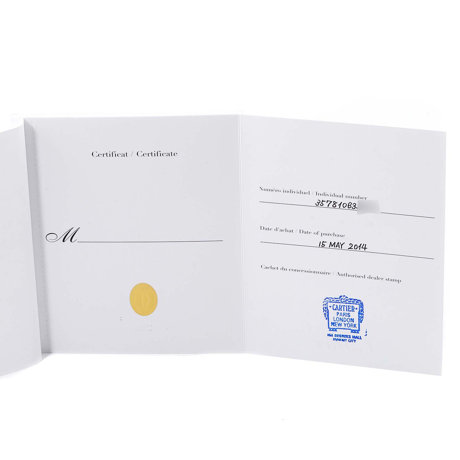 The image shows the warranty certificate for a Calibre de Cartier model by Cartier, displayed open and flat.