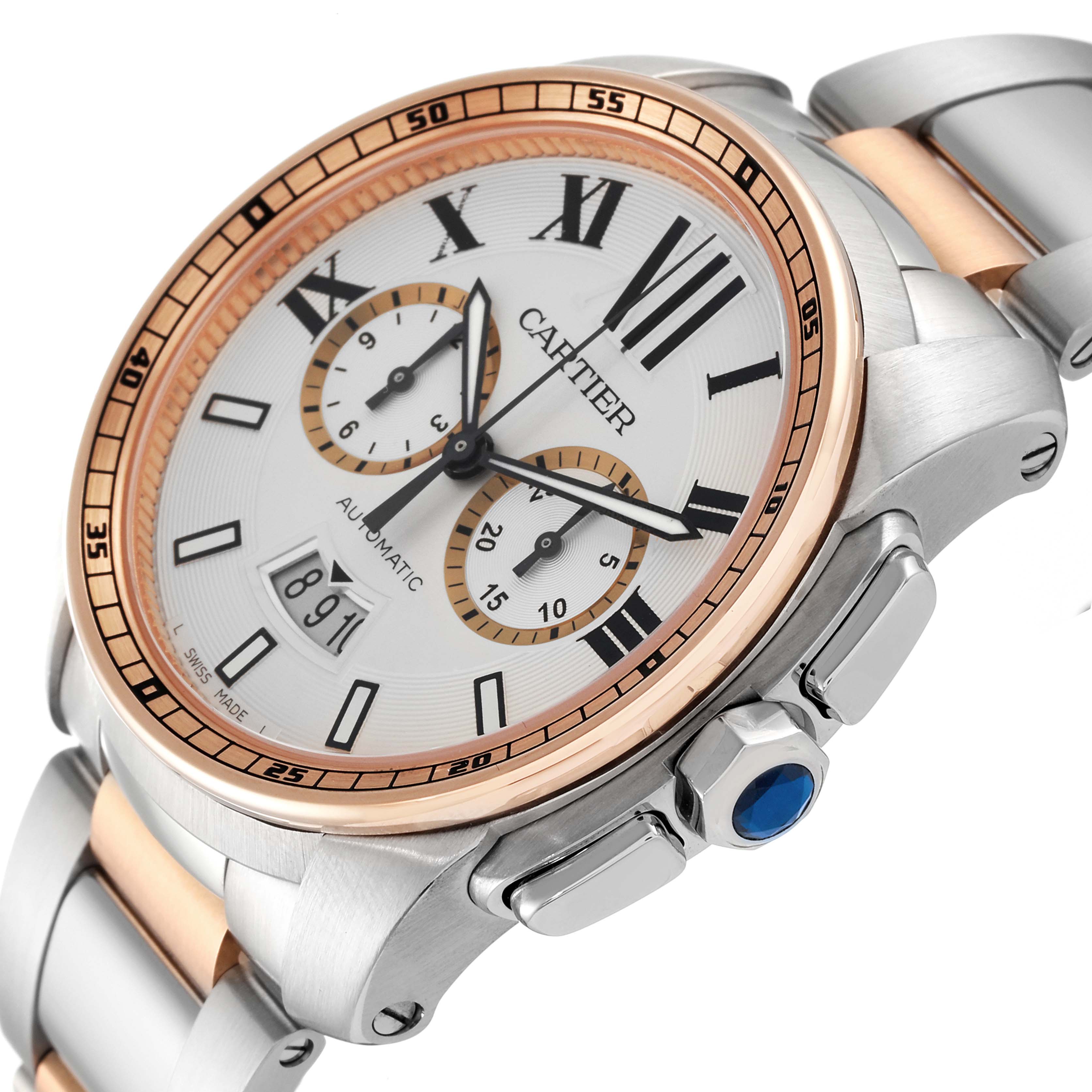 The image shows a Calibre de Cartier watch by Cartier at an oblique angle highlighting the dial, bezel, crown, and part of the bracelet.