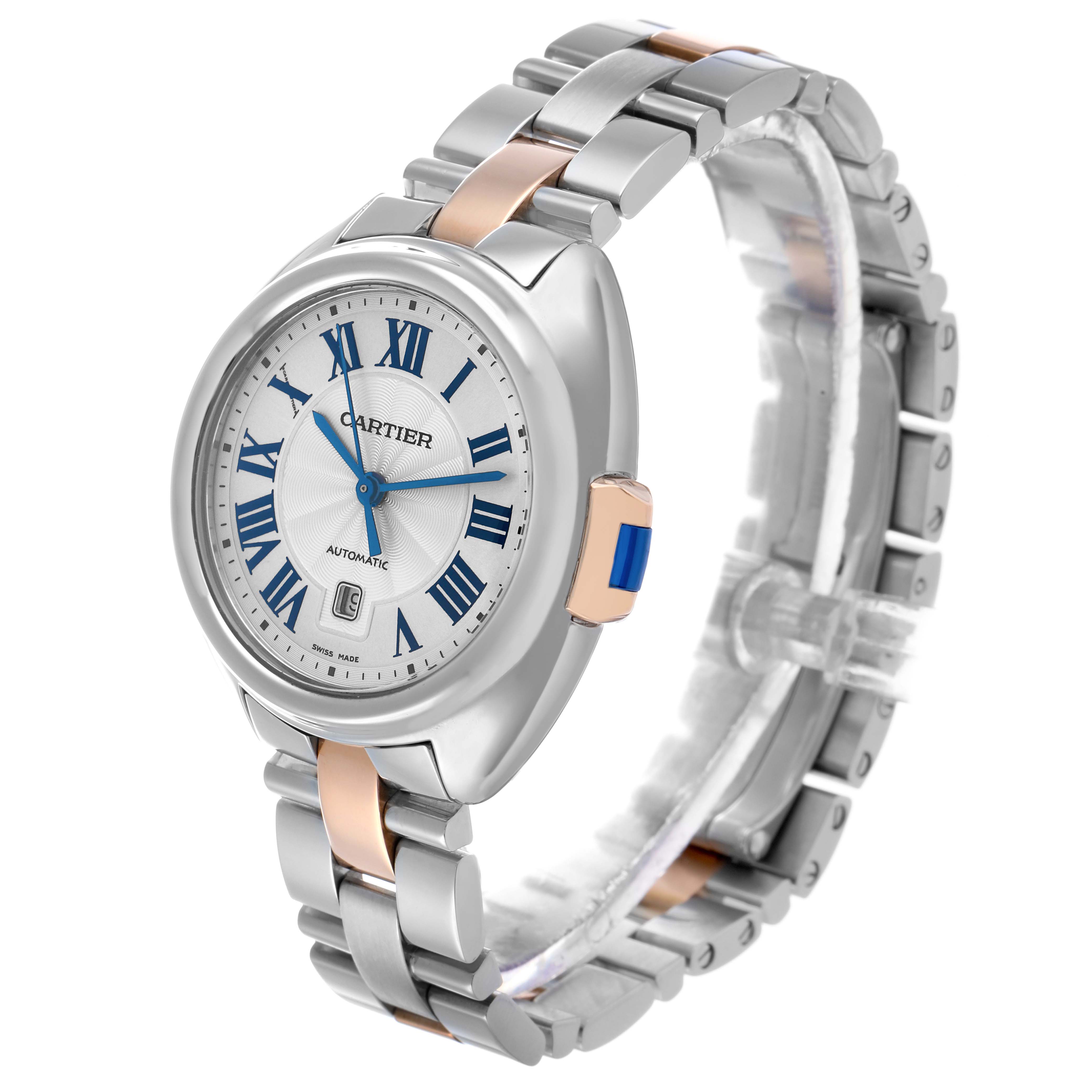 The Cartier Clé model is shown at a three-quarter angle, highlighting the face, bracelet, and crown details.