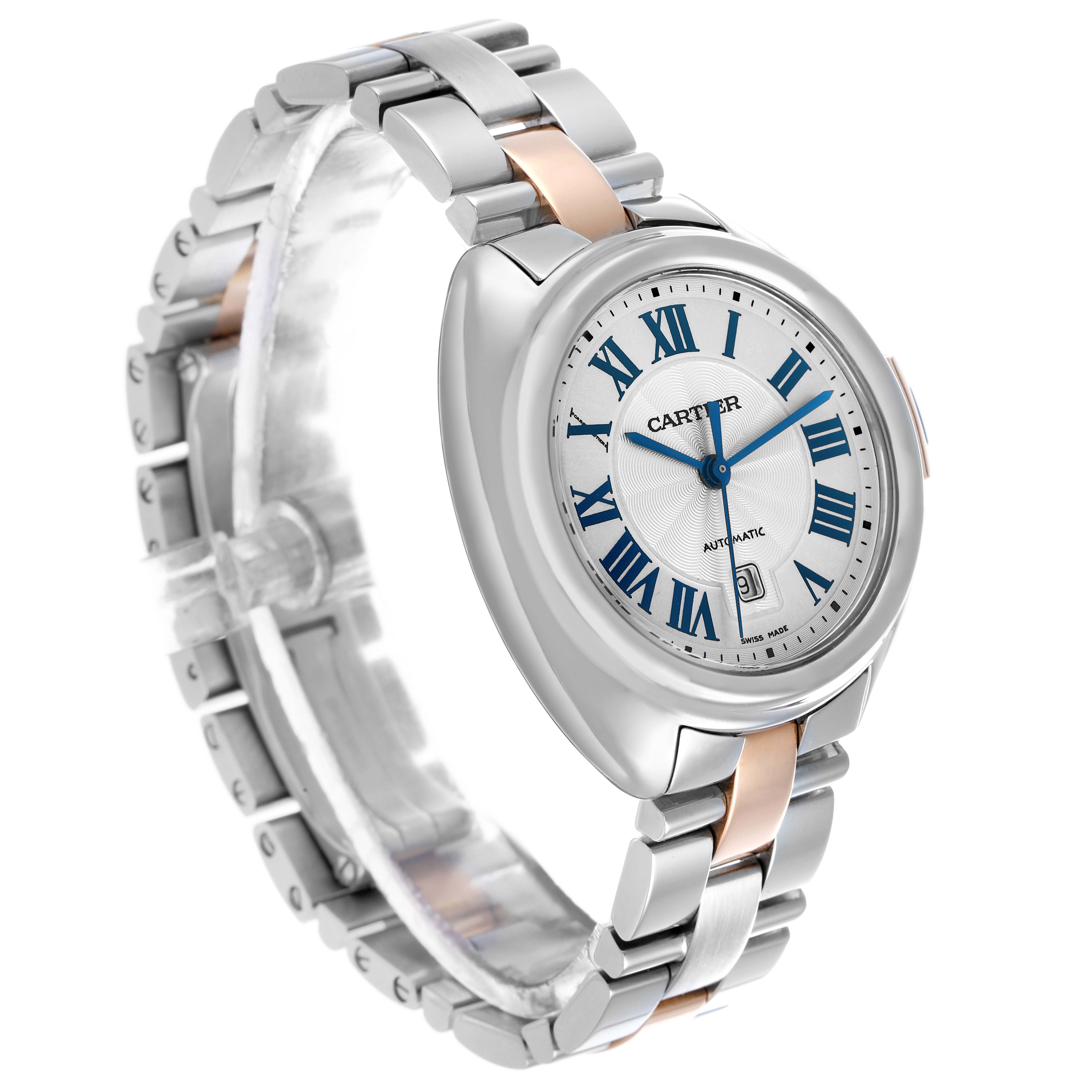 The Cartier Clé watch is shown at a slight angle, highlighting the face, Roman numerals, and bracelet links.