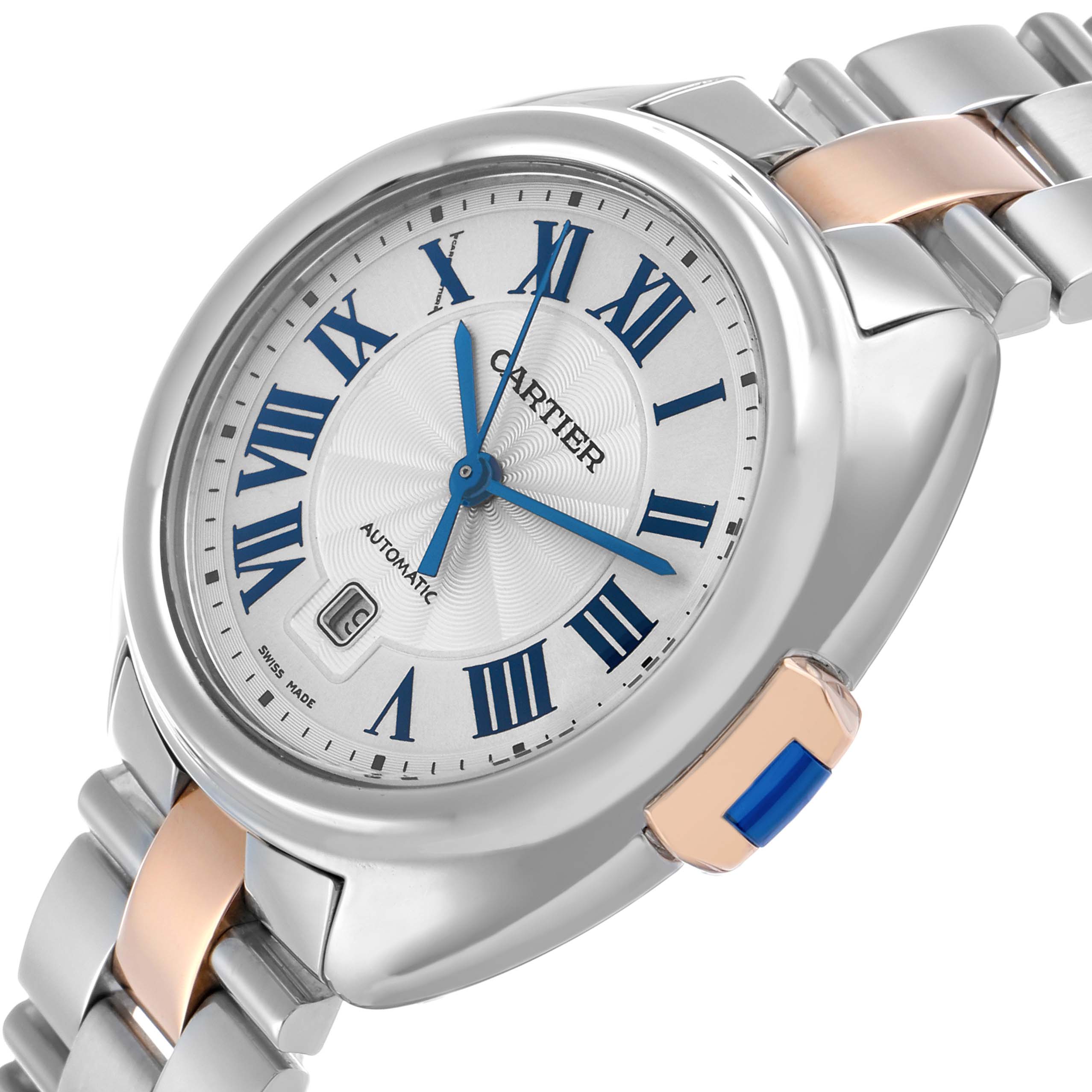 The Cartier Clé watch is shown from a slightly elevated side angle, highlighting its face, crown, and bracelet.