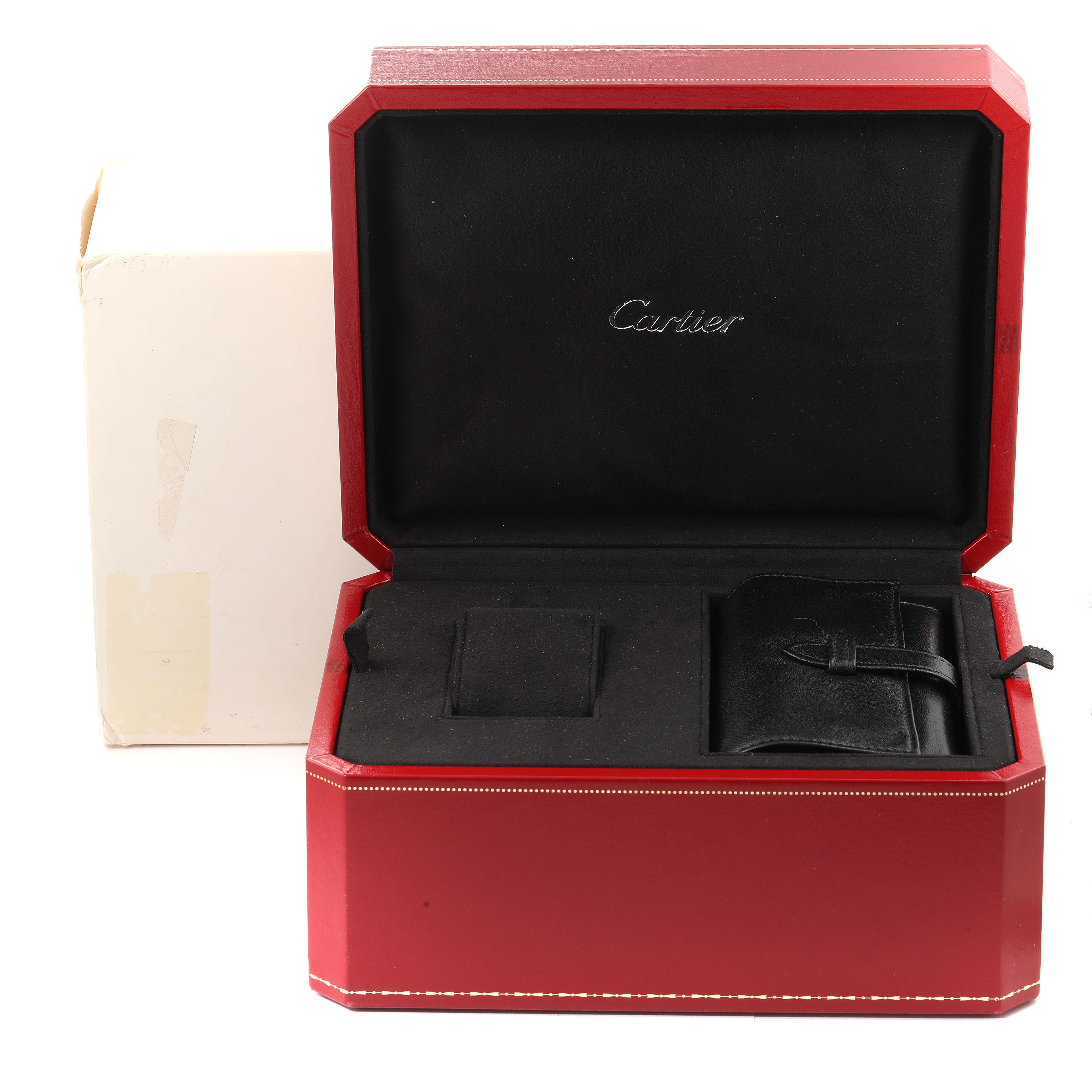 This image shows an empty Cartier Roadster W62020X6 Men's Stainless Steel Black Dial W62020X6 Men's Stainless Steel Black Dial watch box with a black interior and visible packaging.