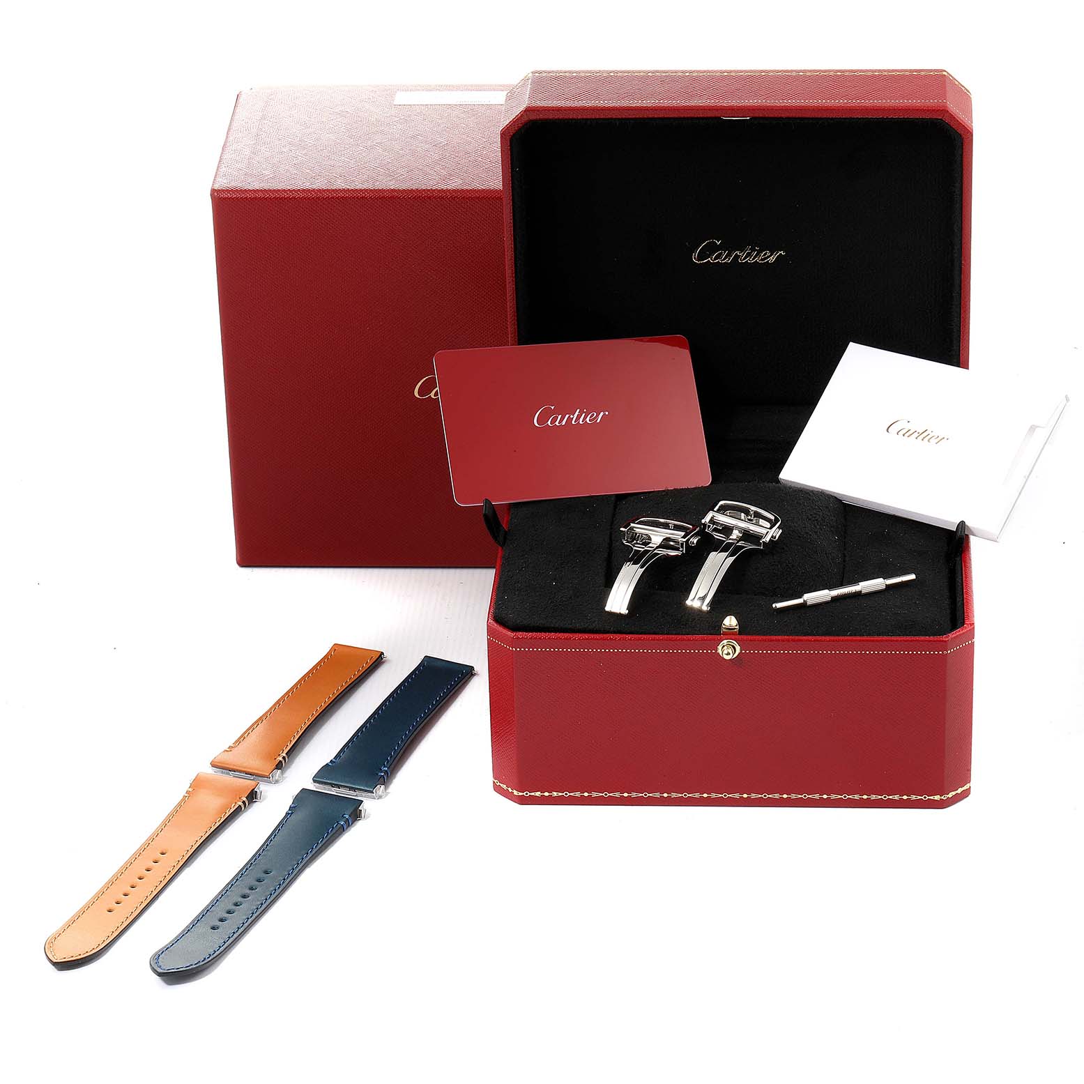 This image shows a Cartier Santos WSSA0030 Men's Stainless Steel Blue Dial WSSA0030 Men's Stainless Steel Blue Dial watch and accessories including straps, a screwdriver, and documentation from a top-view angle.