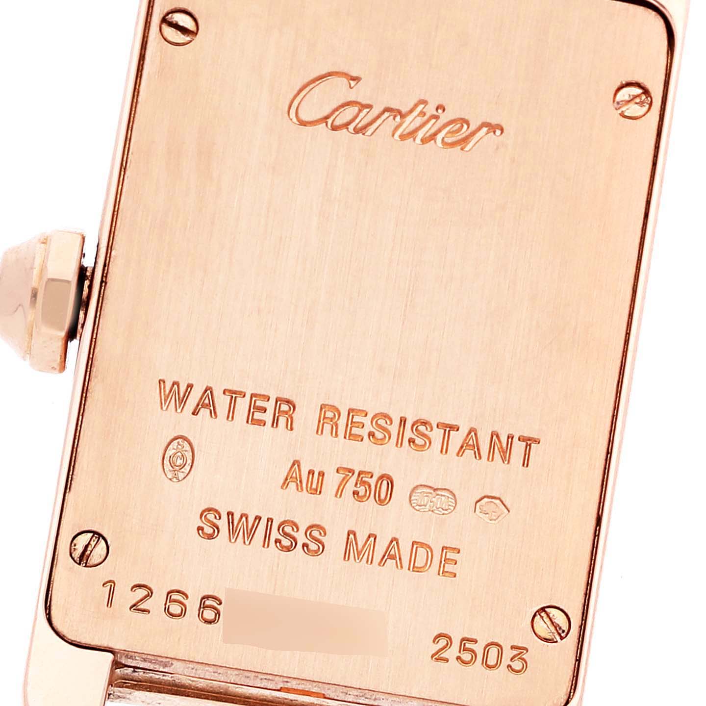 The image shows the back case of the Cartier Tank Americaine WB7079M5 Women's Rose Gold Silver Dial WB7079M5 Women's Rose Gold Silver Dial watch, highlighting its engraving details.