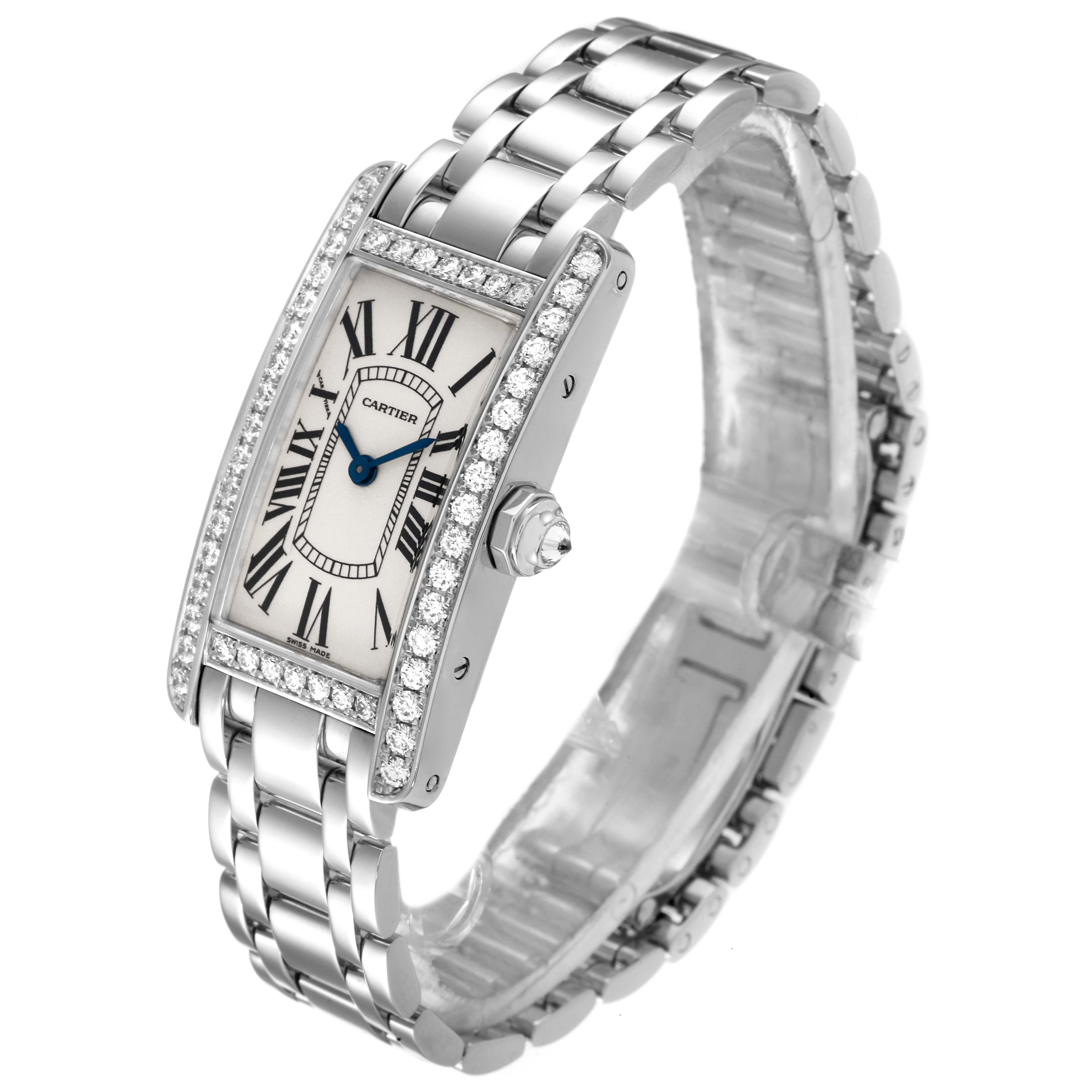 The image shows a Cartier Tank Americaine WB7073L1 Women's White Gold Silver Dial WB7073L1 Women's White Gold Silver Dial watch at an angle, highlighting its face, bracelet, crown, and side view.