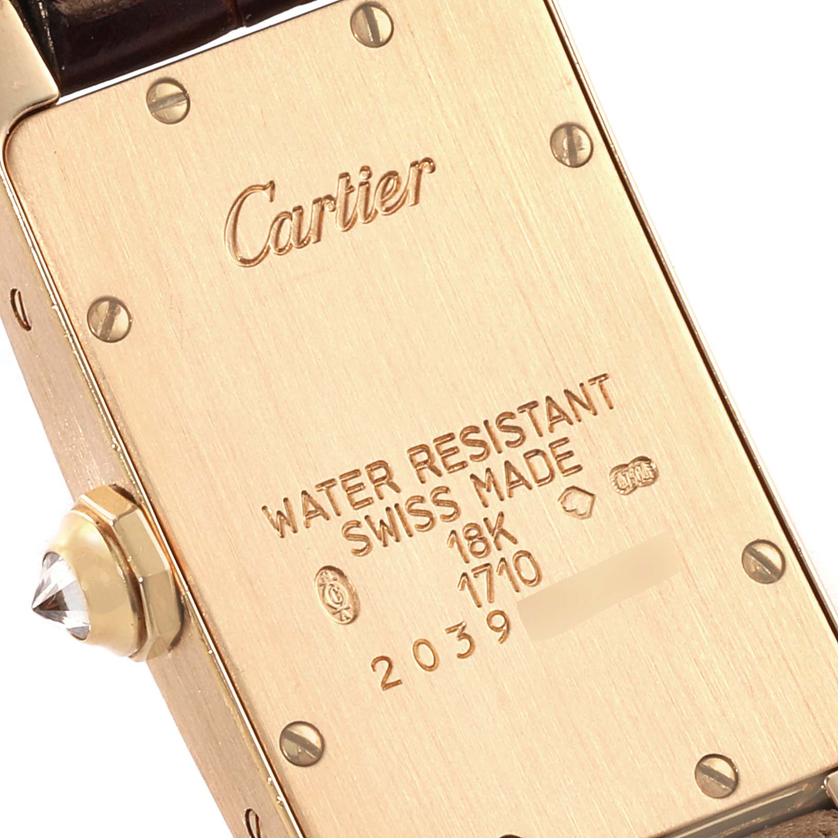 This image shows the back case of a Cartier Tank Americaine WB701251 Women
s Yellow Gold Silver Dial WB701251 Women
s Yellow Gold Silver Dial watch, highlighting water resistance and 18K gold details.