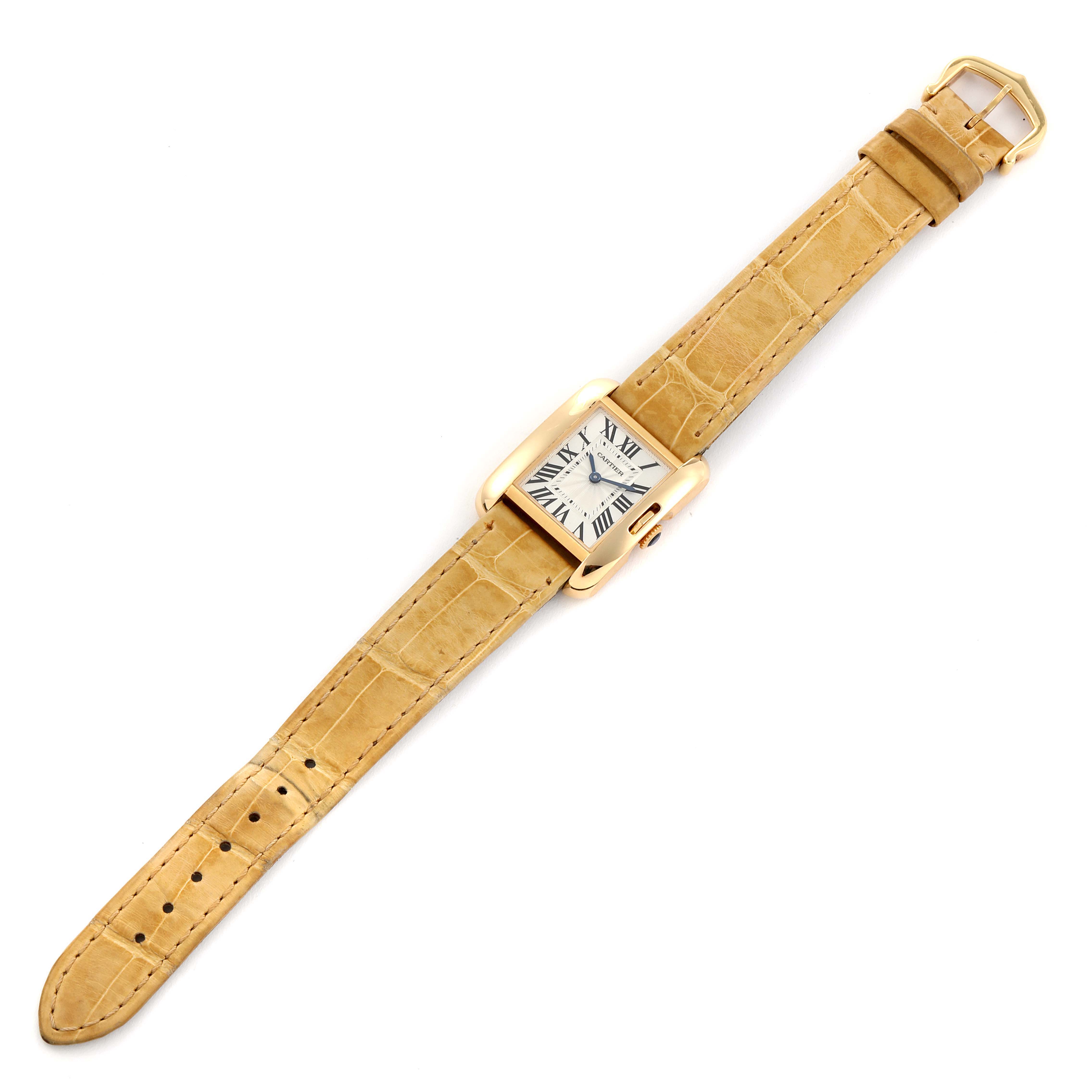 The Cartier Tank Anglaise W5310028 Women's Yellow Gold Silver Dial W5310028 Women's Yellow Gold Silver Dial watch is shown from a top-down angle, displaying the face, strap, and buckle.