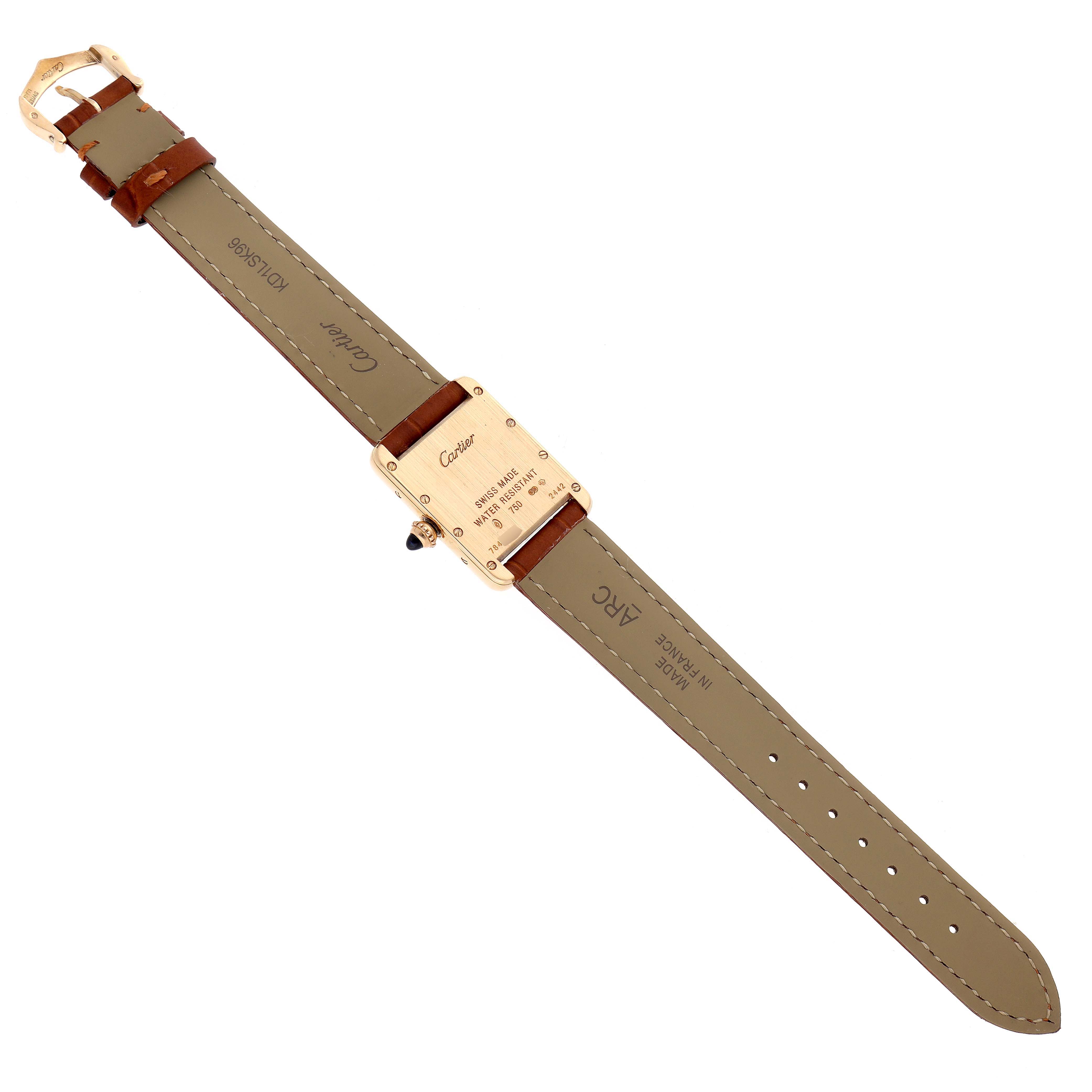 The image shows a Cartier Tank Louis W1529856 Women's Yellow Gold Silver Dial watch from the back, highlighting the case back, strap, and buckle.