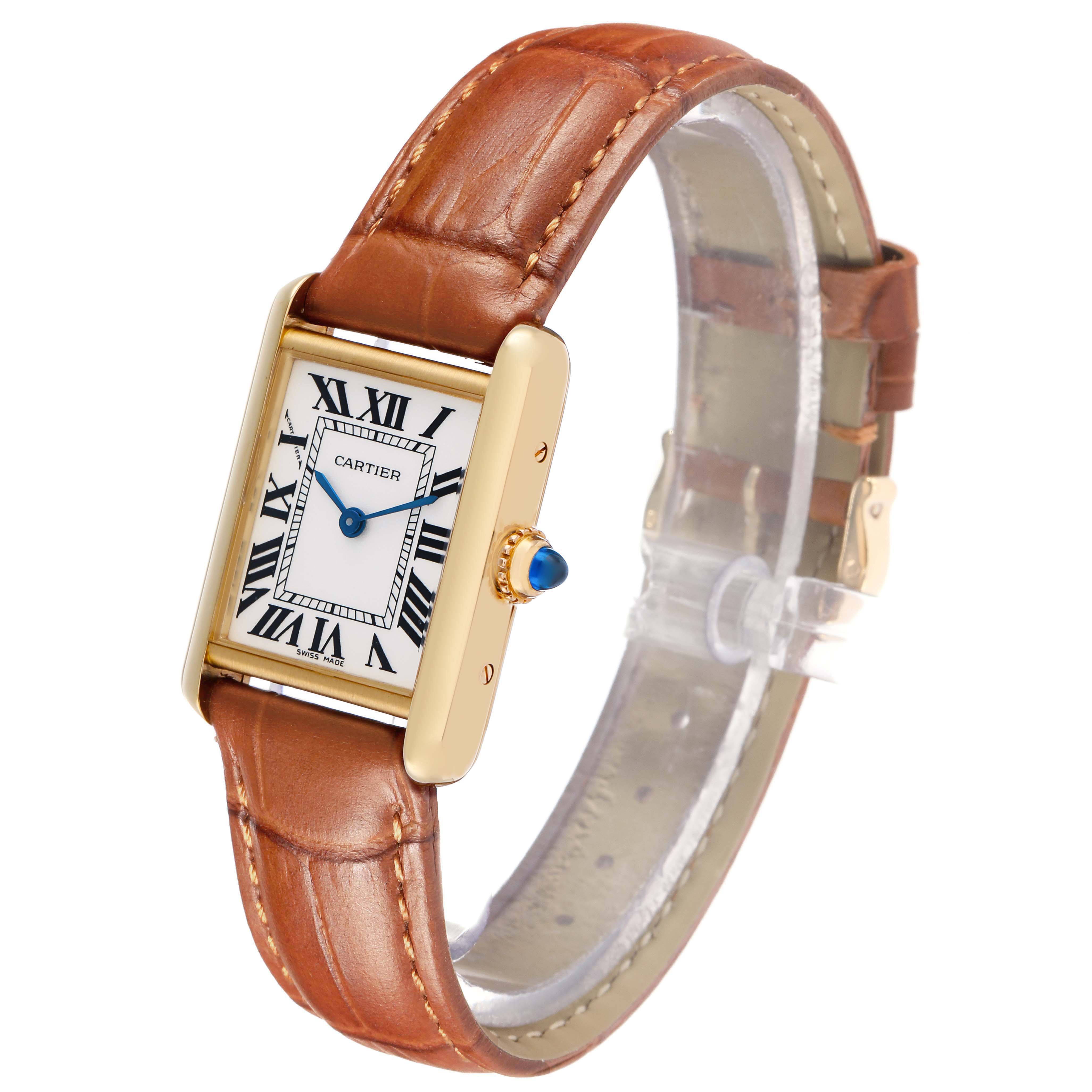 The Cartier Tank Louis W1529856 Women's Yellow Gold Silver Dial watch is shown at an angled side view, highlighting its rectangular face, Roman numerals, and leather strap.