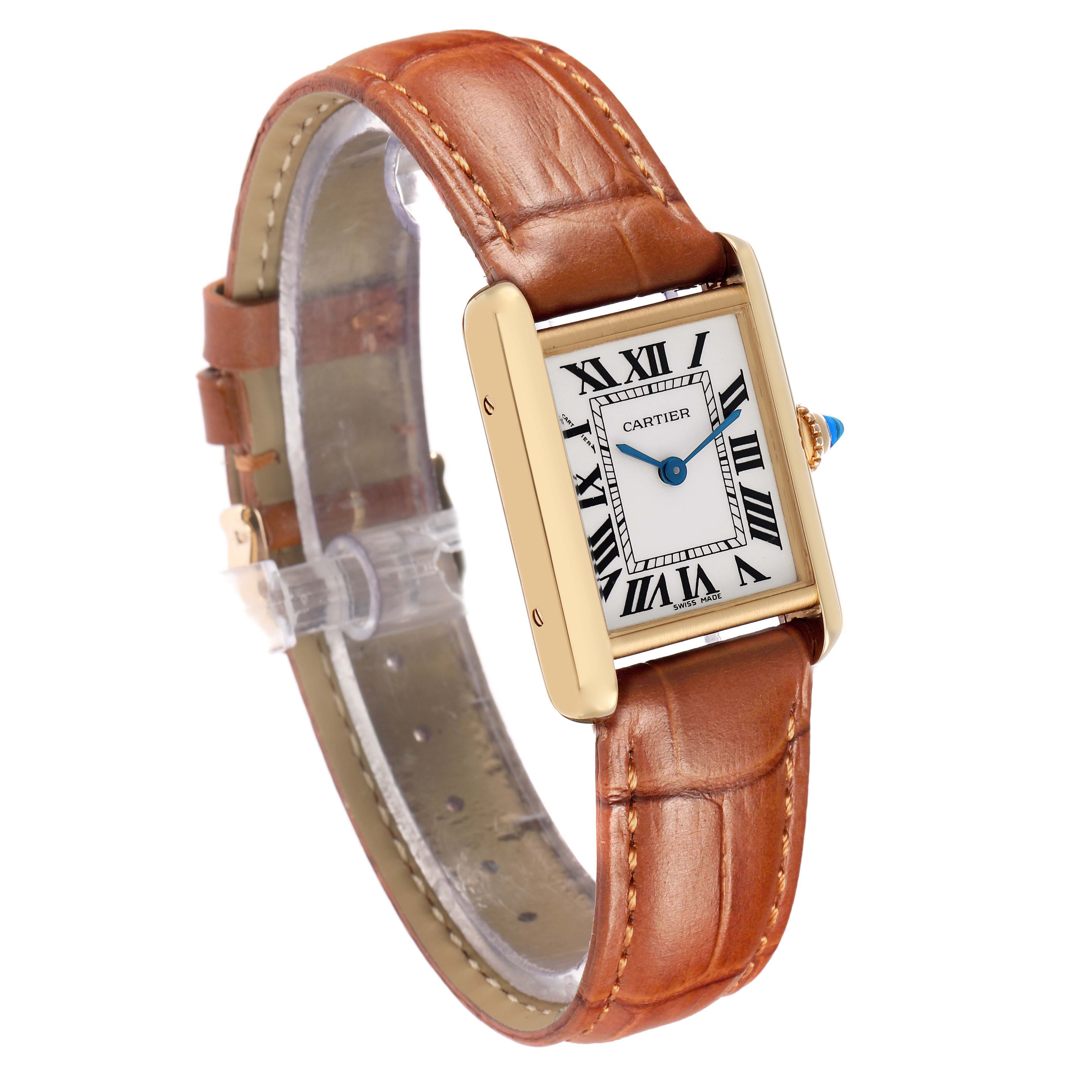 The Cartier Tank Louis W1529856 Women's Yellow Gold Silver Dial watch is shown at a slight diagonal angle, displaying its rectangular face and brown leather strap.