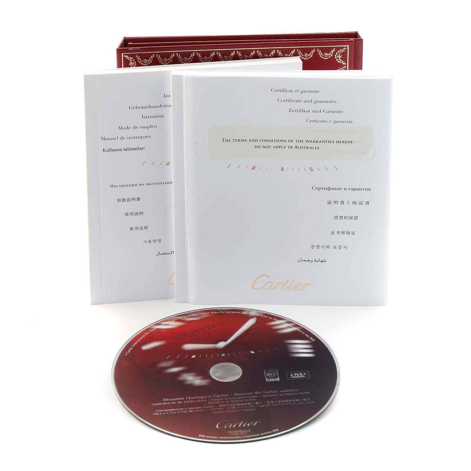 The image shows Cartier Tank Louis W1529856 Women's Yellow Gold Silver Dial watch accessories, including manuals, a warranty card, and a DVD, all from a frontal angle.