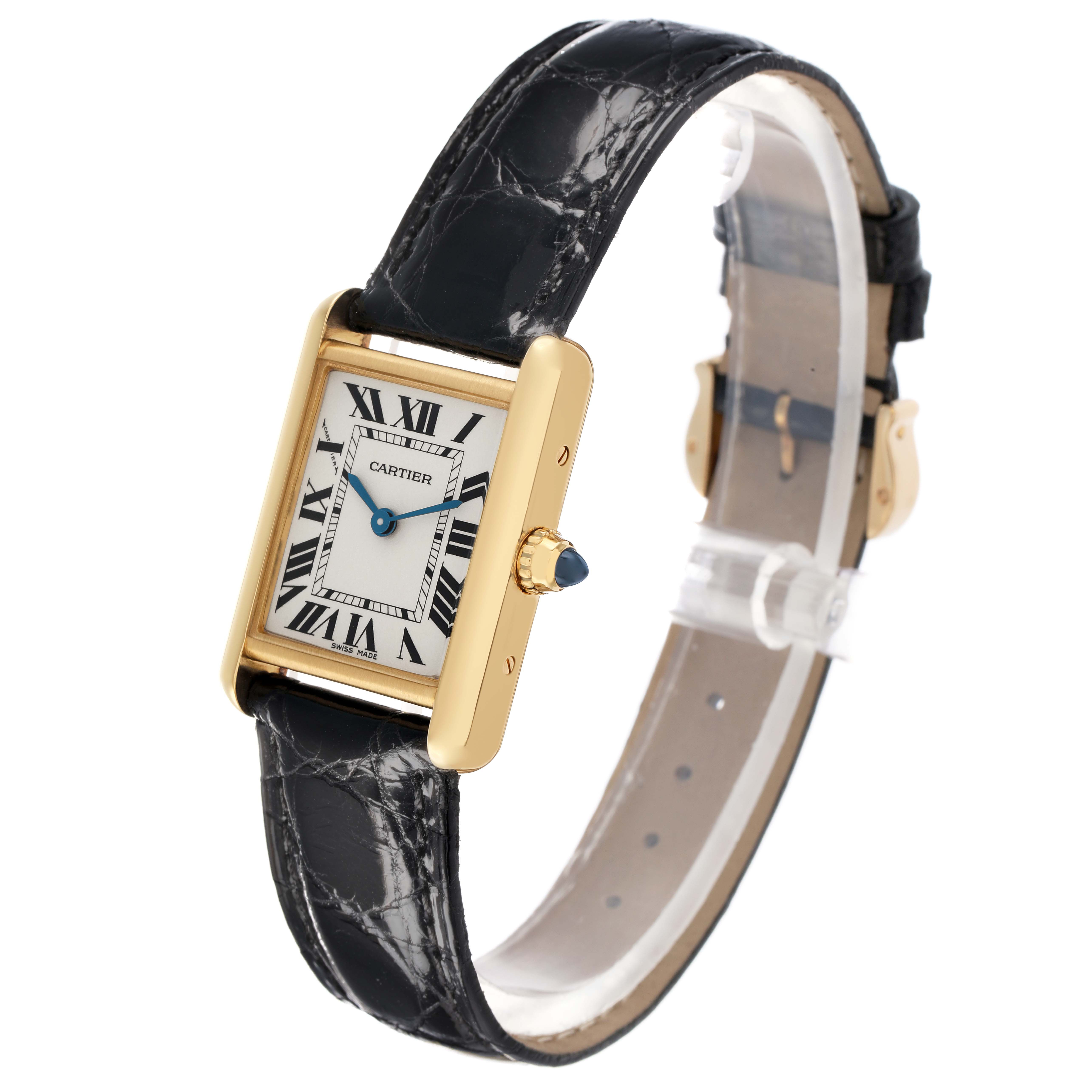 The Cartier Tank Louis W1529856 Women's Yellow Gold Silver Dial watch is shown at an angle highlighting the face, case, crown, and black leather strap.