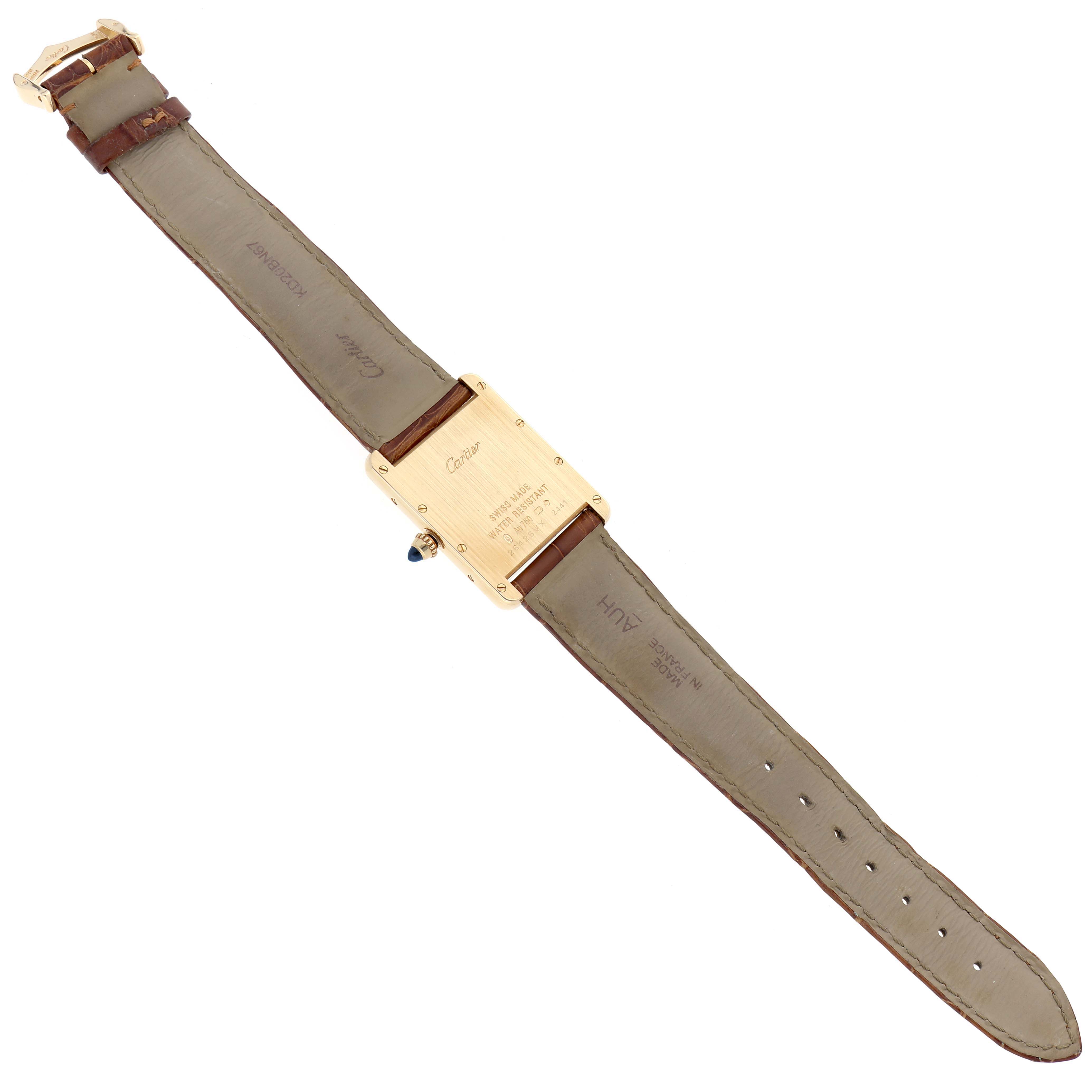 The Cartier Tank Louis W1529756 Men's Yellow Gold Silver Dial watch is shown from the back, displaying the case, straps, and clasp.