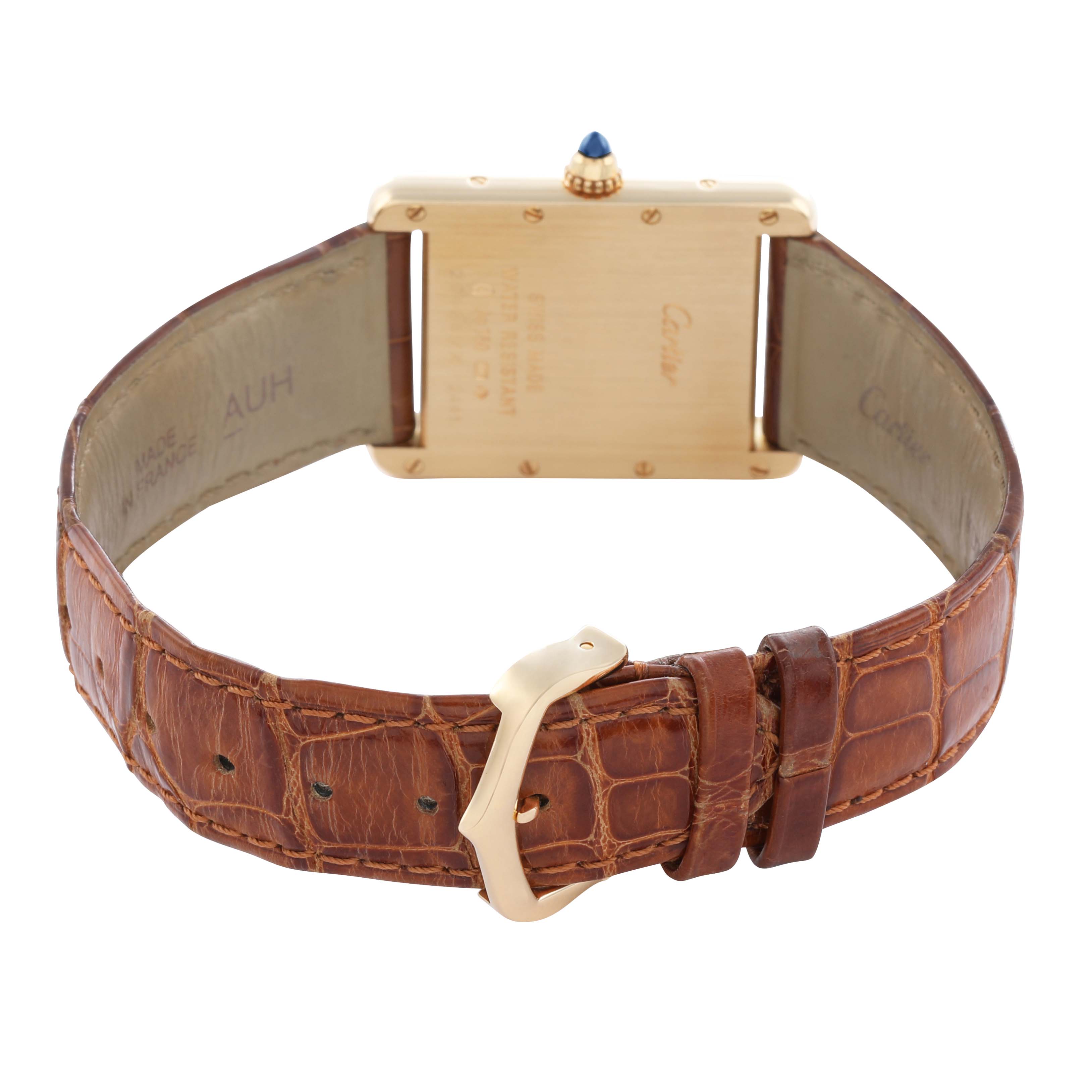 The image shows the back of a Cartier Tank Louis W1529756 Men's Yellow Gold Silver Dial watch, highlighting the case back, crown, and leather strap with buckle.