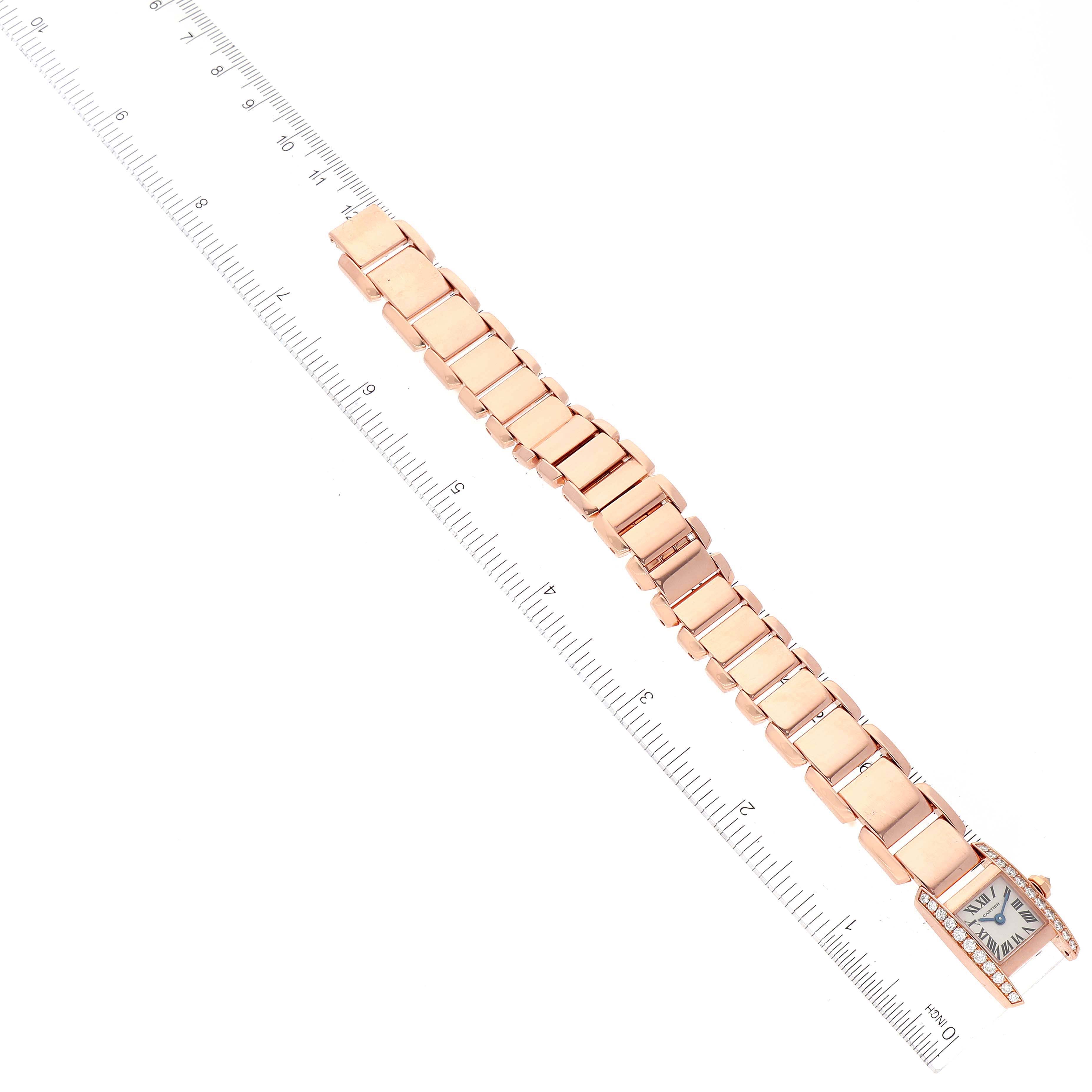 The image shows a Cartier Tankissime W650048H Women's Rose Gold Silver Dial W650048H Women's Rose Gold Silver Dial model watch laid flat with a ruler for scale, highlighting the bracelet and face.