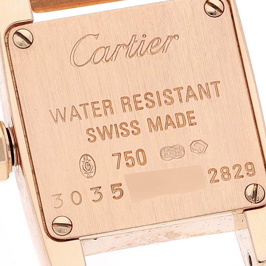 This image shows the back case of a Cartier Tankissime W650048H Women's Rose Gold Silver Dial W650048H Women's Rose Gold Silver Dial watch, highlighting its engraved details.