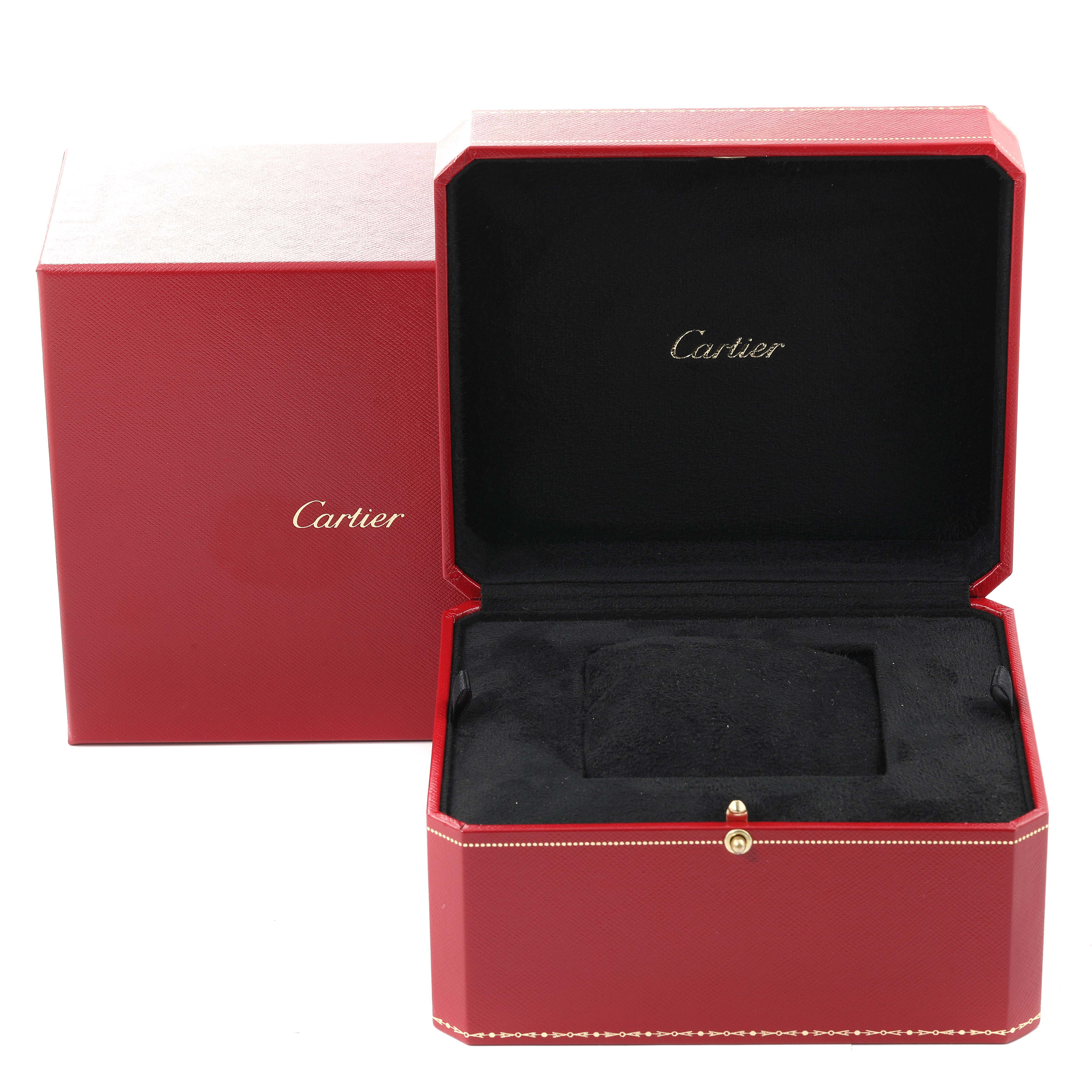 This image shows an open red Cartier box for the Tortue model watch, with black interior padding and the Cartier logo inside.