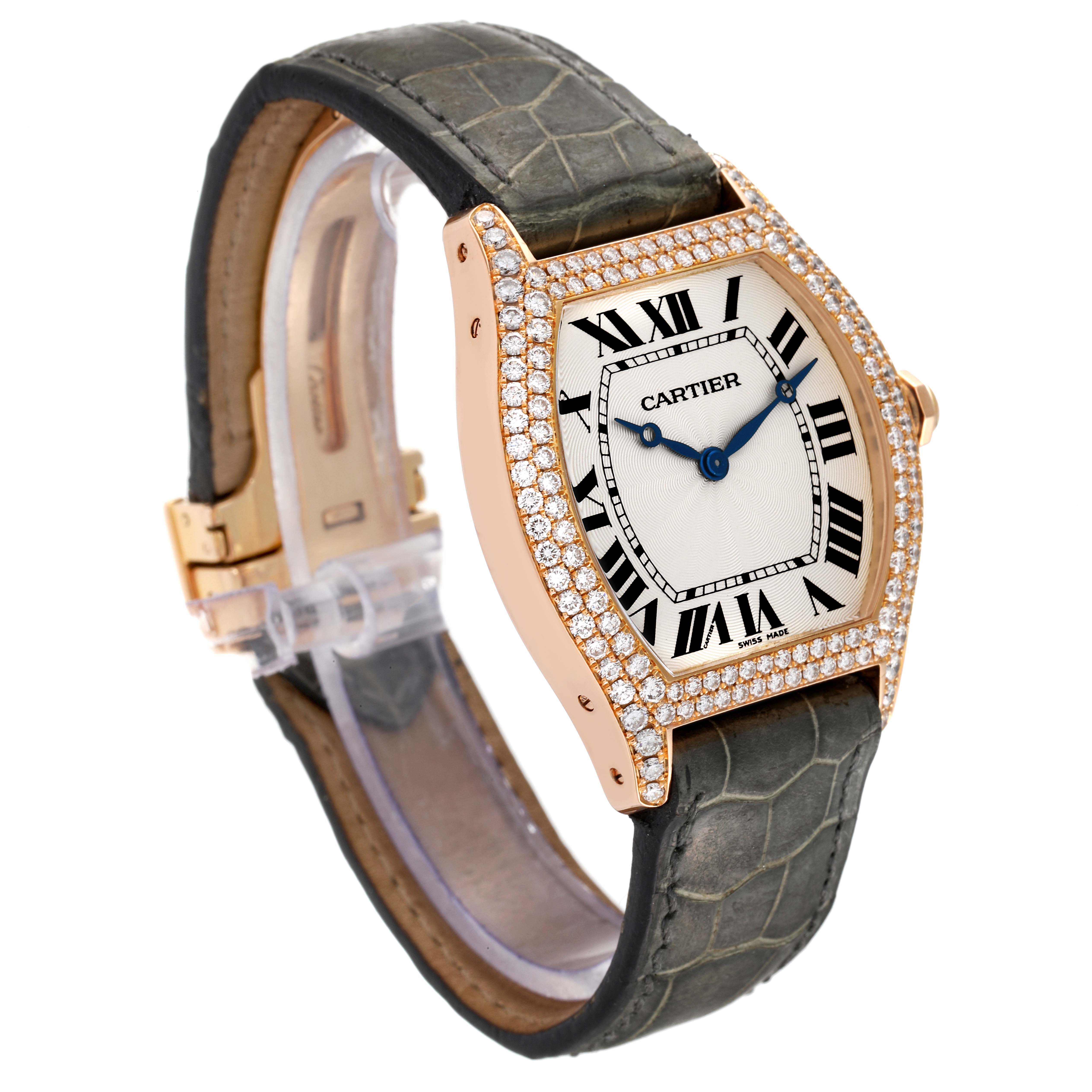 The Cartier Tortue WA503751 Women's Rose Gold Silver Dial WA503751 Women's Rose Gold Silver Dial watch is shown at a slight side angle, highlighting its diamond-encrusted bezel, Roman numeral dial, and alligator strap.