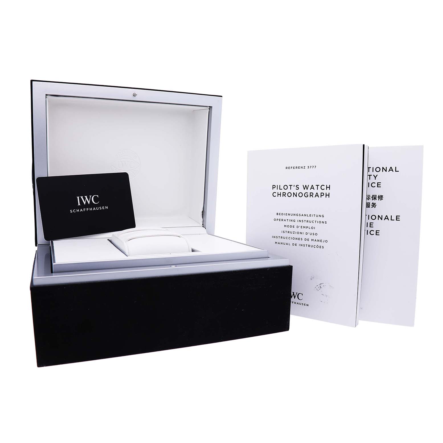 The image shows the IWC Pilot IW377714 Men's Stainless Steel Blue Dial watch's box, warranty card, and manuals from a front angle.