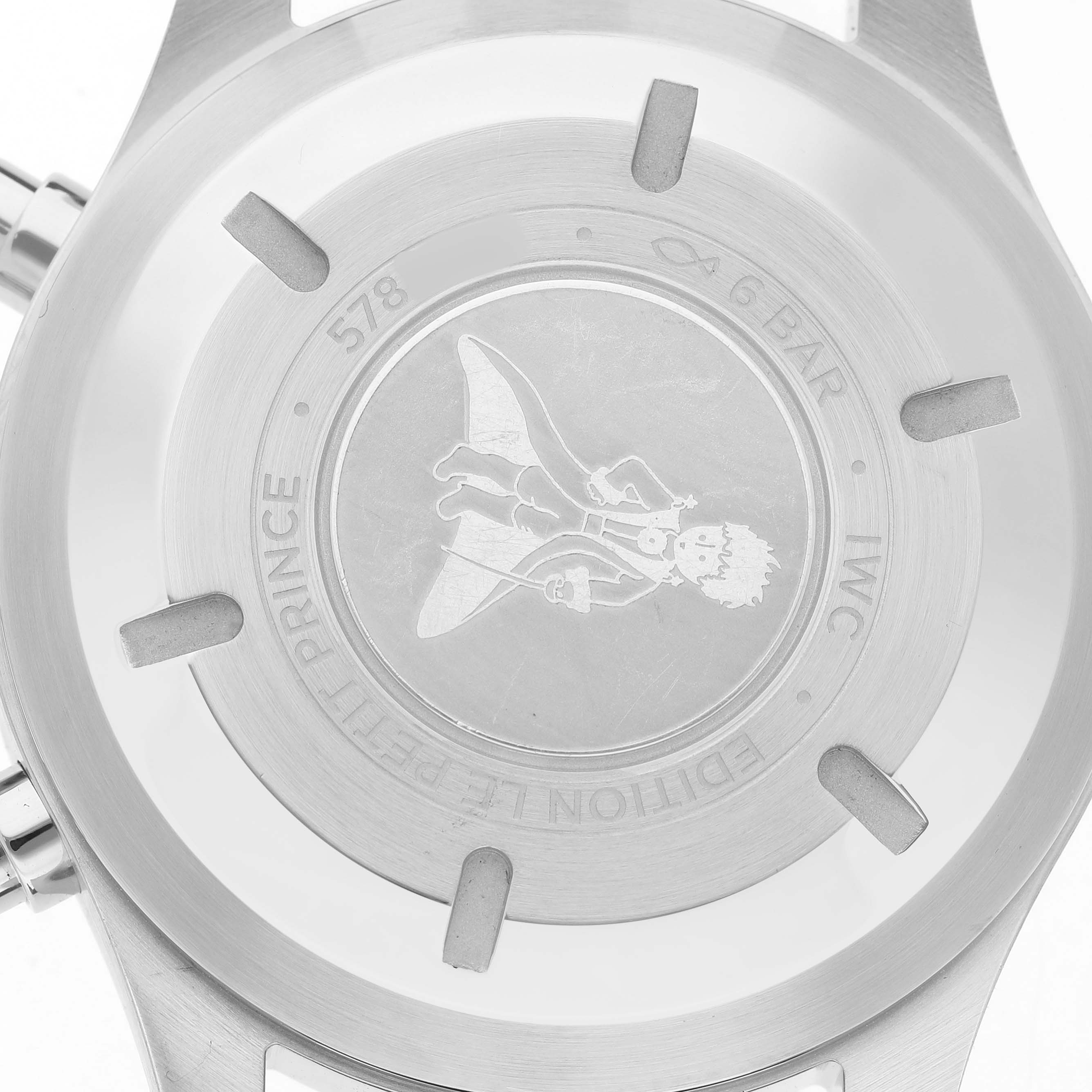 The image shows the case back of the IWC Pilot IW377714 Men's Stainless Steel Blue Dial model, featuring "Le Petit Prince" engraving and brand details.
