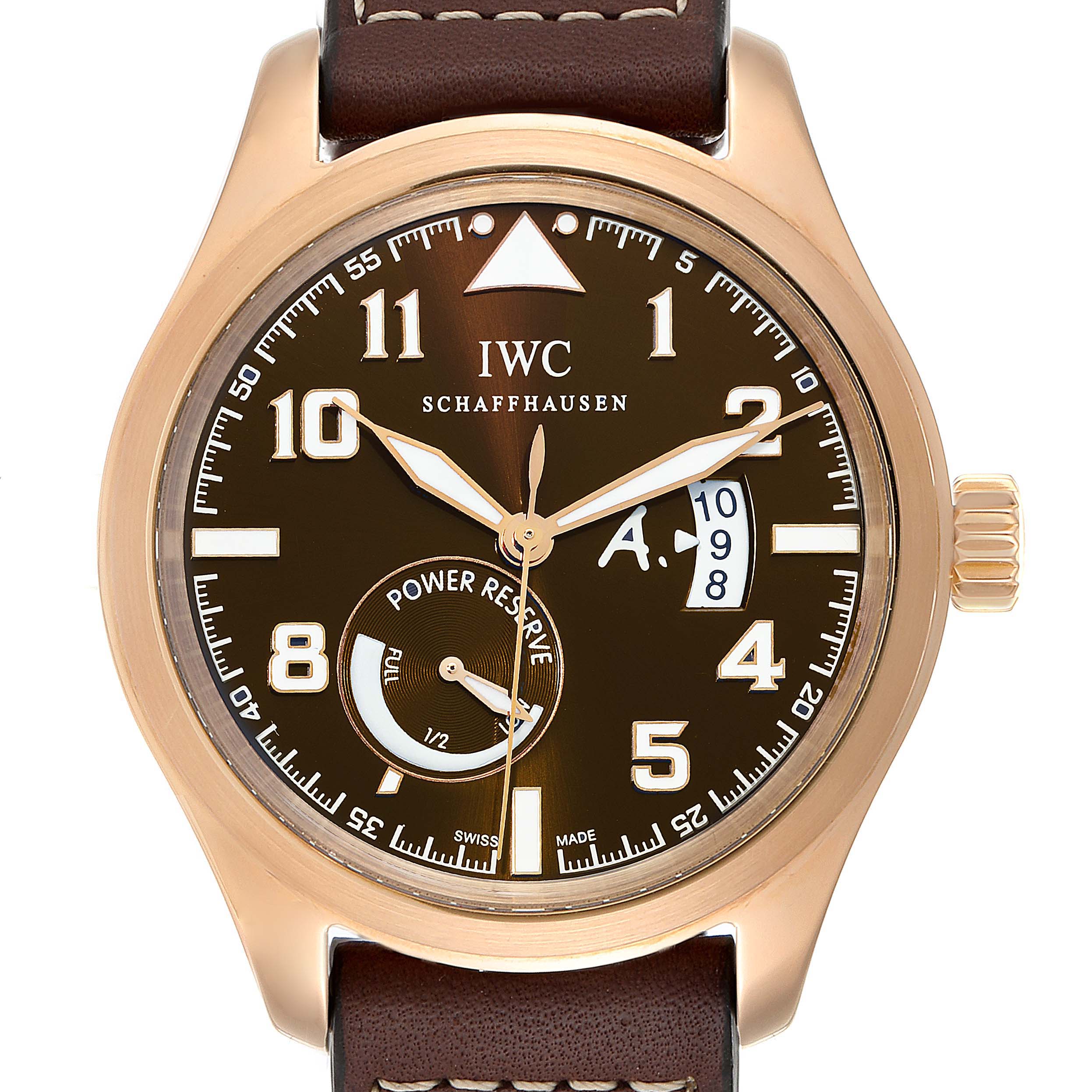 The image shows the front view of an IWC Pilot IW320103 Men's Rose Gold Brown Dial IW320103 Men's Rose Gold Brown Dial model watch with a brown strap, brown dial, and power reserve indicator.
