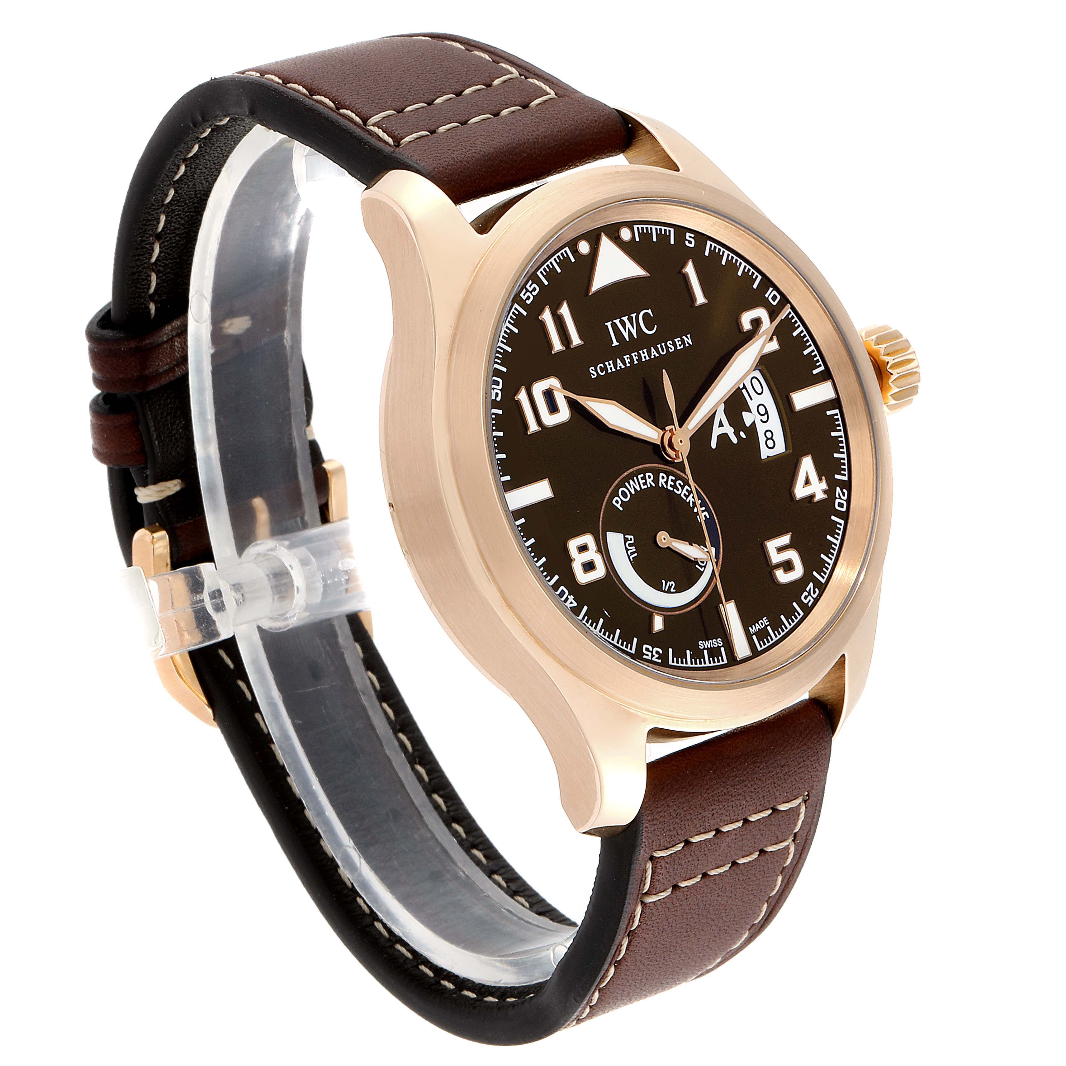 This image shows an IWC Pilot IW320103 Men's Rose Gold Brown Dial IW320103 Men's Rose Gold Brown Dial model watch from an angled side view, highlighting its face, crown, and leather strap.