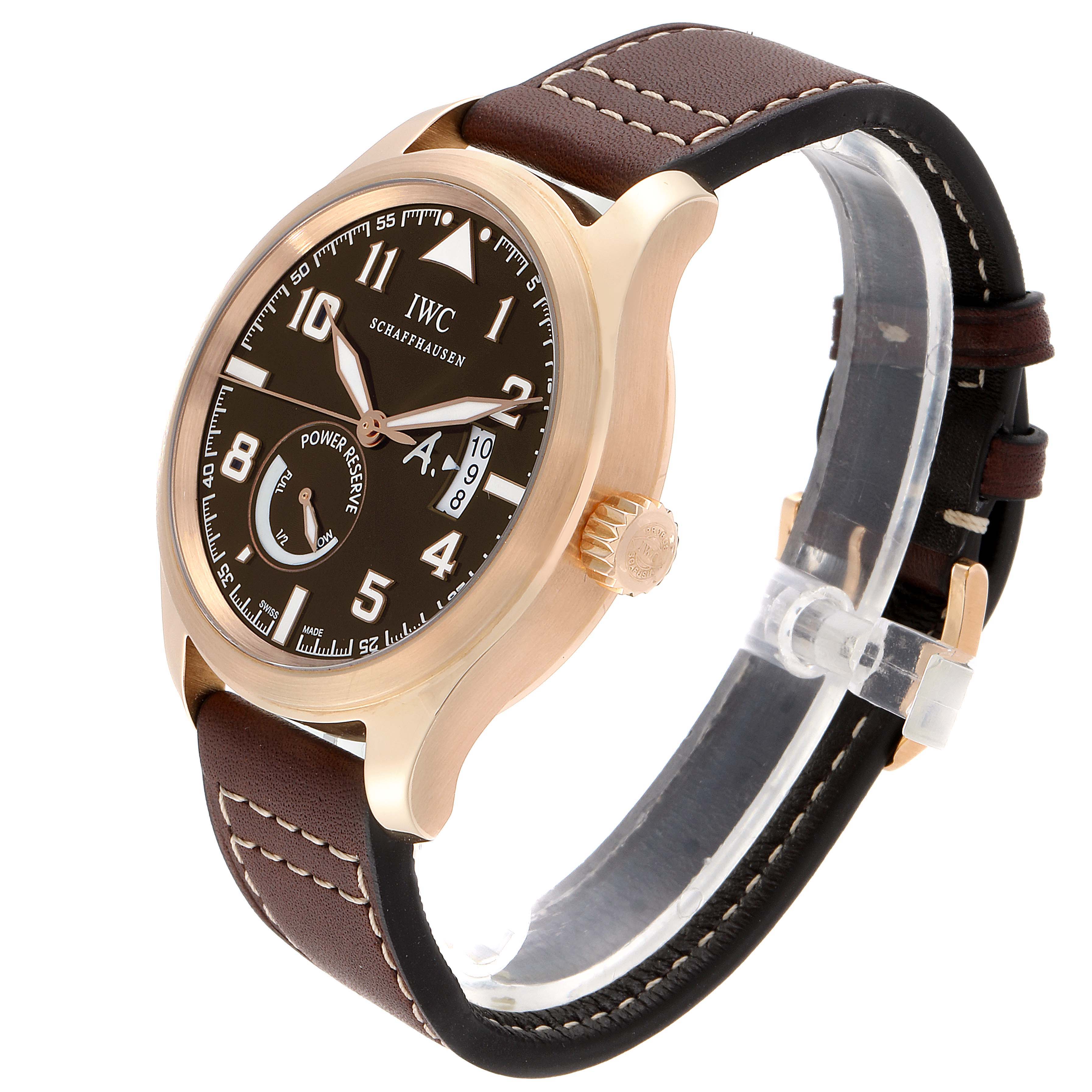 This is an angled view of the IWC Pilot IW320103 Men's Rose Gold Brown Dial IW320103 Men's Rose Gold Brown Dial model watch showing the face, crown, and leather strap.