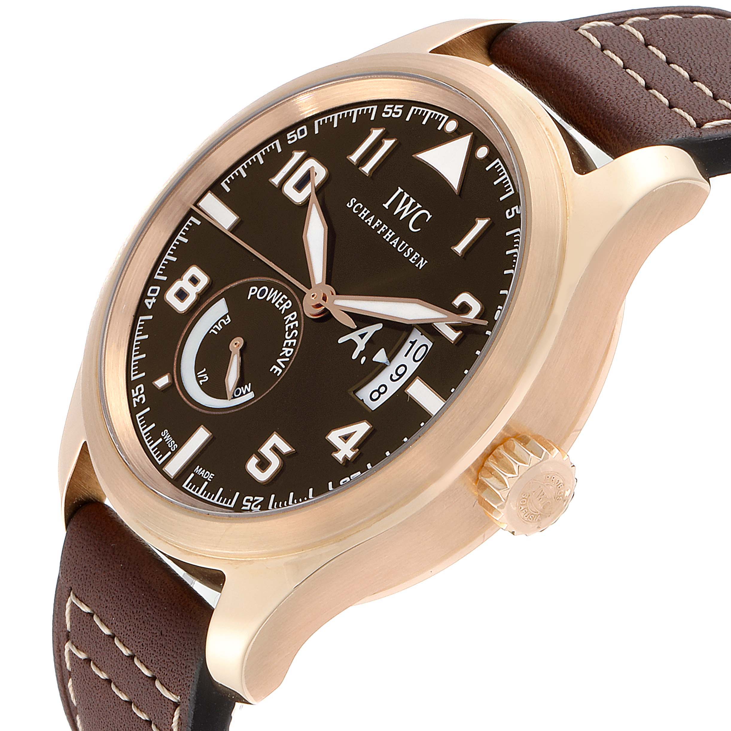 The image shows a side-angle view of an IWC Pilot IW320103 Men's Rose Gold Brown Dial IW320103 Men's Rose Gold Brown Dial watch, highlighting the face, crown, and leather strap.
