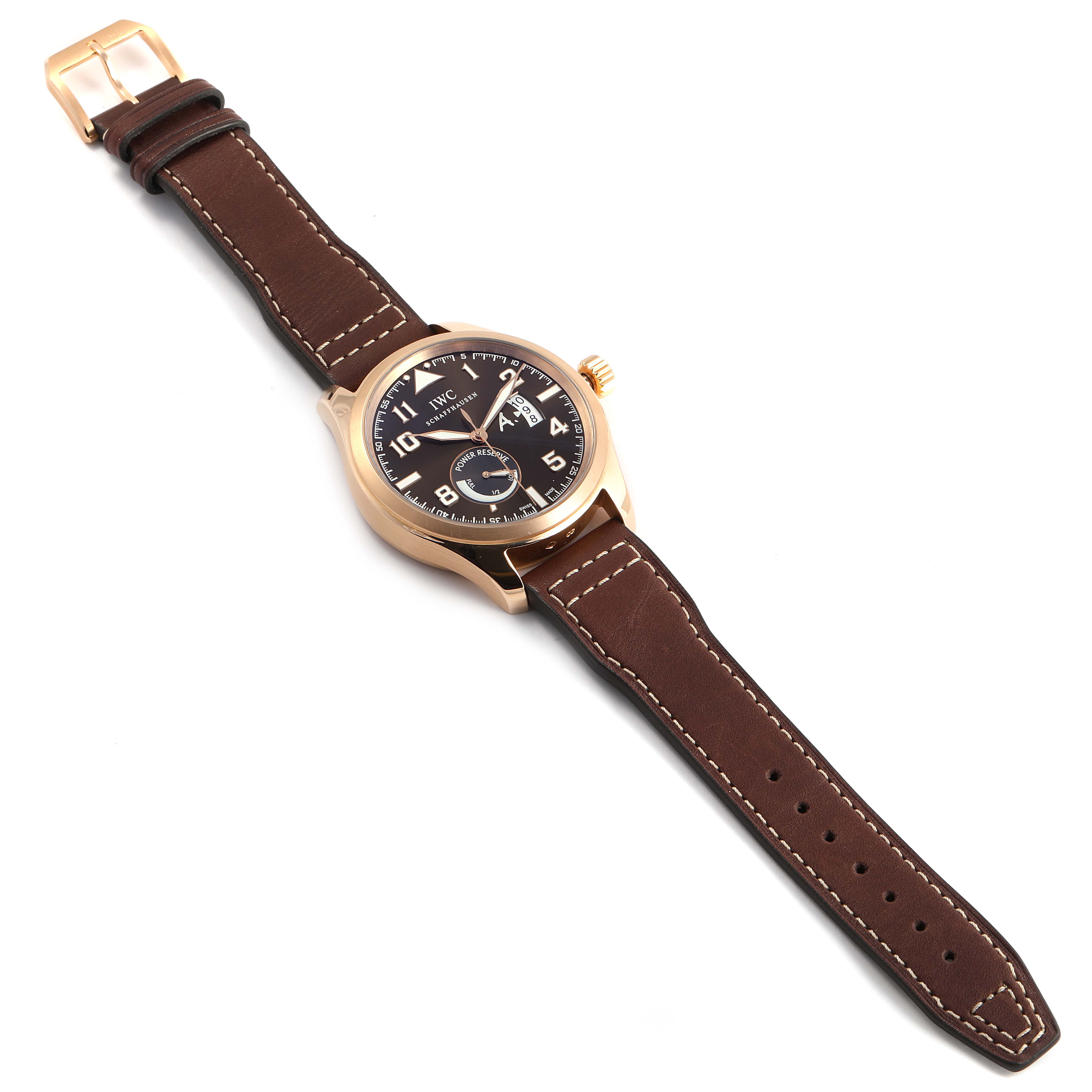 The image shows an IWC Pilot IW320103 Men's Rose Gold Brown Dial IW320103 Men's Rose Gold Brown Dial model watch, angled from above to display its face and leather strap.