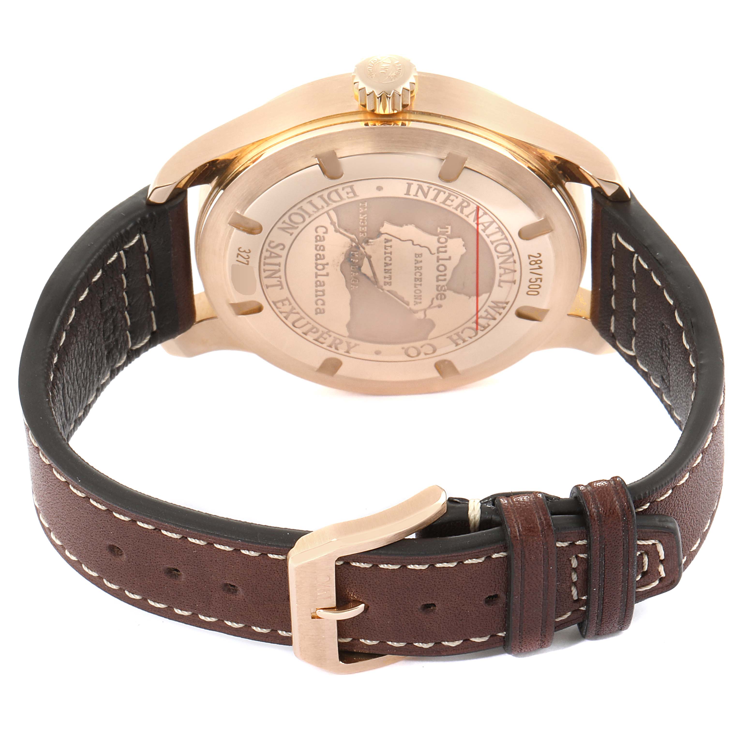 The image shows the back view of an IWC Pilot IW320103 Men's Rose Gold Brown Dial IW320103 Men's Rose Gold Brown Dial model watch, highlighting the engraved case back and brown leather strap.