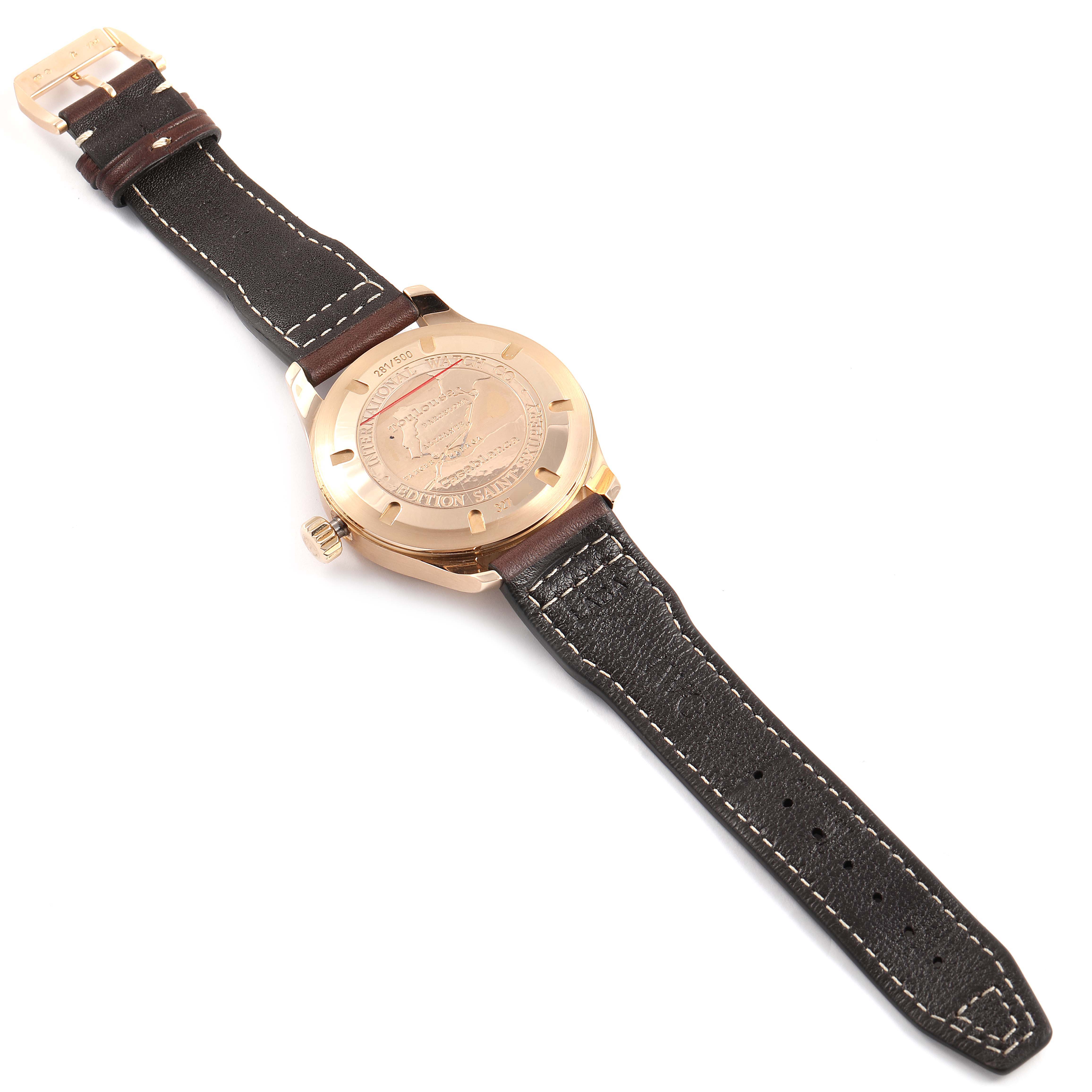 The image shows the back view of an IWC Pilot IW320103 Men's Rose Gold Brown Dial IW320103 Men's Rose Gold Brown Dial model watch, highlighting the case back and leather strap.