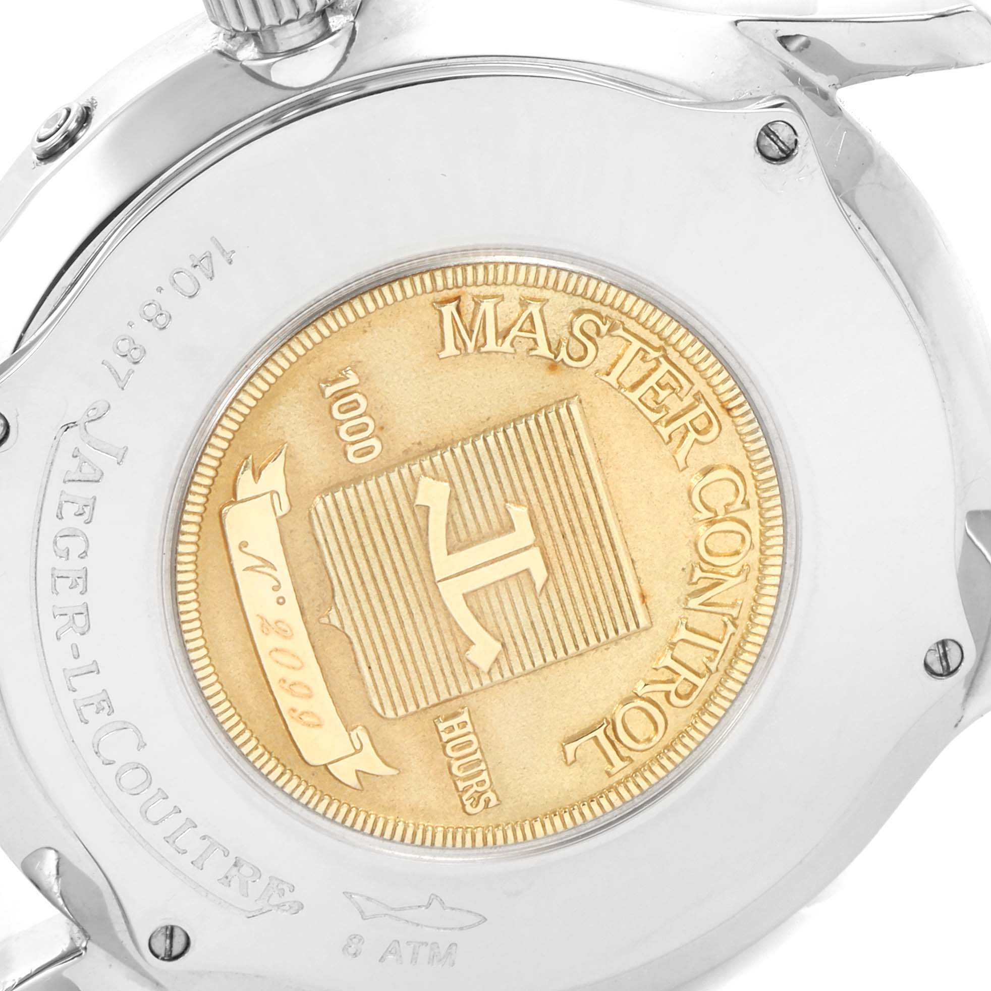 The image shows the back case of the Jaeger-LeCoultre Master Control model, featuring its gold emblem and engravings.