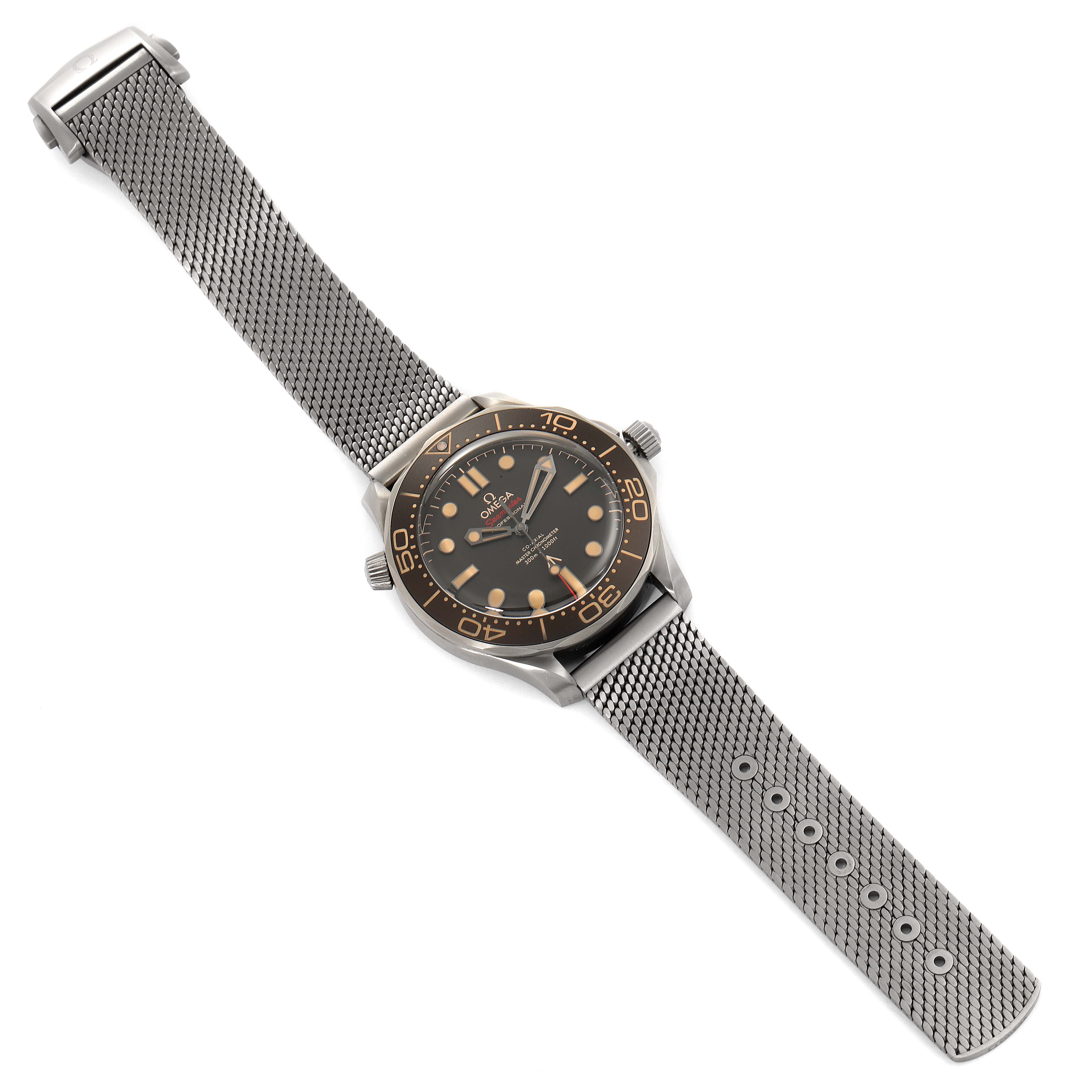 The image shows an angled view of an Omega Seamaster 210.92.42.20.01.001 Men's Titanium Brown Dial 210.92.42.20.01.001 Men's Titanium Brown Dial watch, featuring its mesh bracelet and dial with bronze accents.