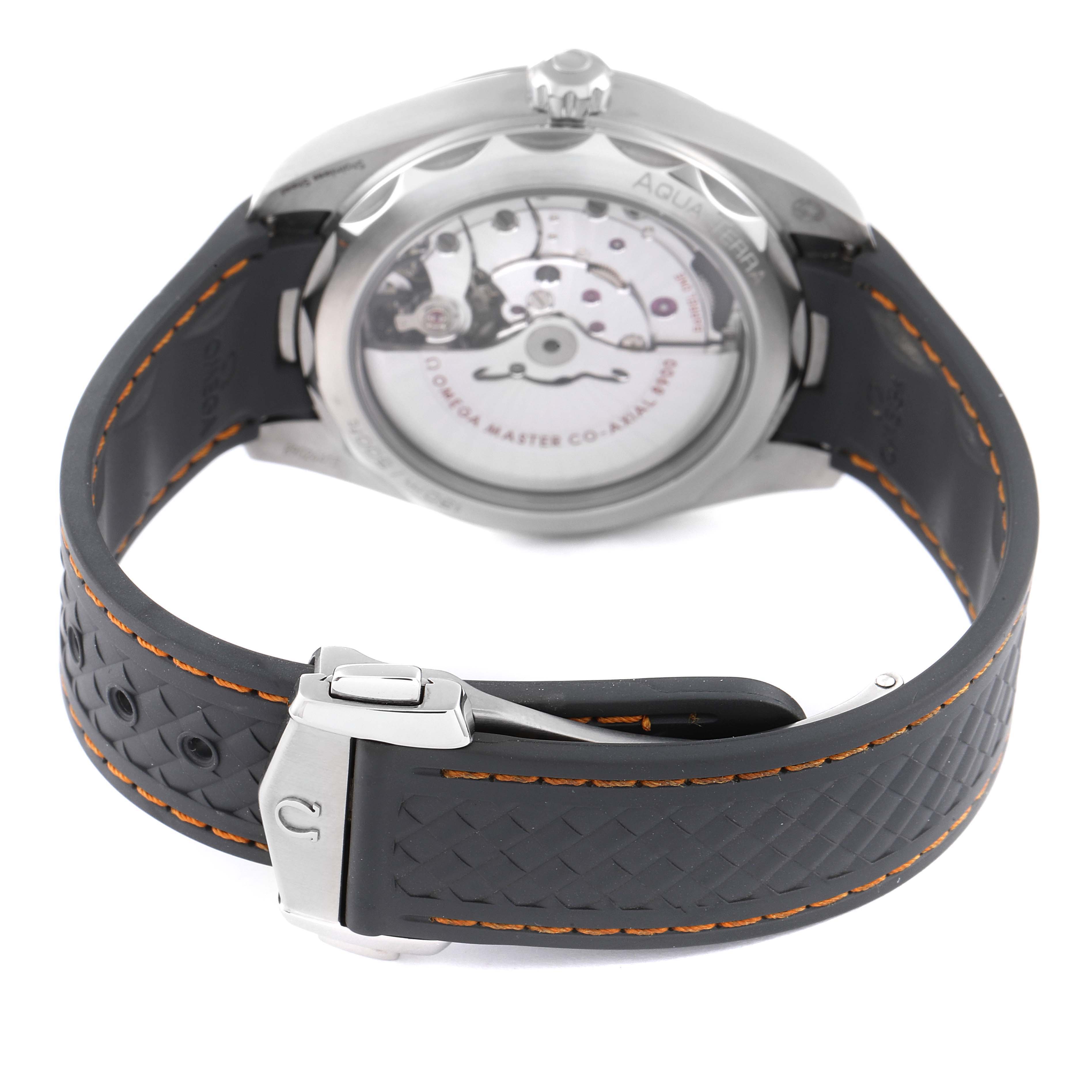 This image shows the underside of the Omega Aqua Terra 220.12.41.21.02.001 Men's Stainless Steel Silver Dial 220.12.41.21.02.001 Men's Stainless Steel Silver Dial watch, focusing on the movement and the rubber strap with orange stitching.
