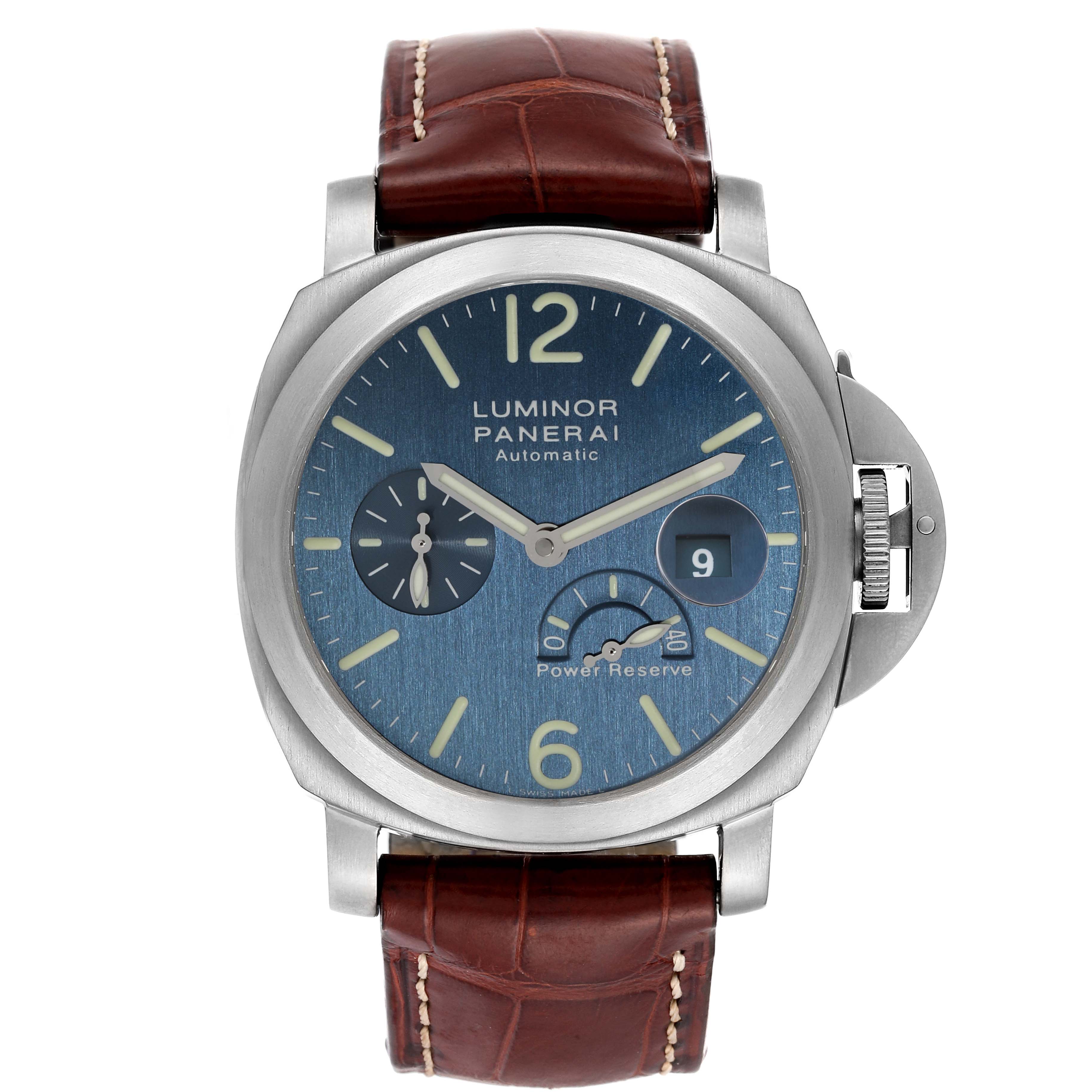 The Luminor Panerai watch is shown from the front, displaying the dial, crown guard, and brown leather strap.