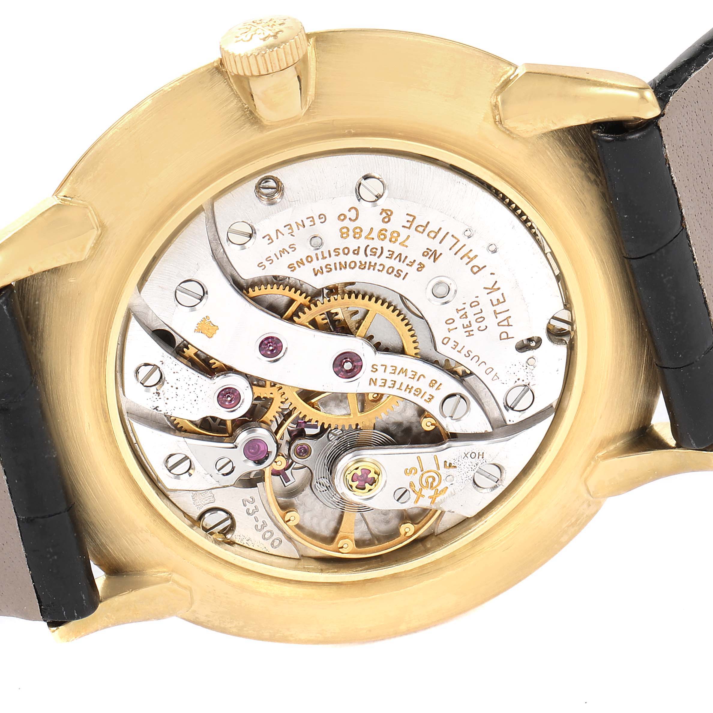 The image shows the movement and inner workings of a Vintage Patek Philippe watch from a back angle with its case back removed.