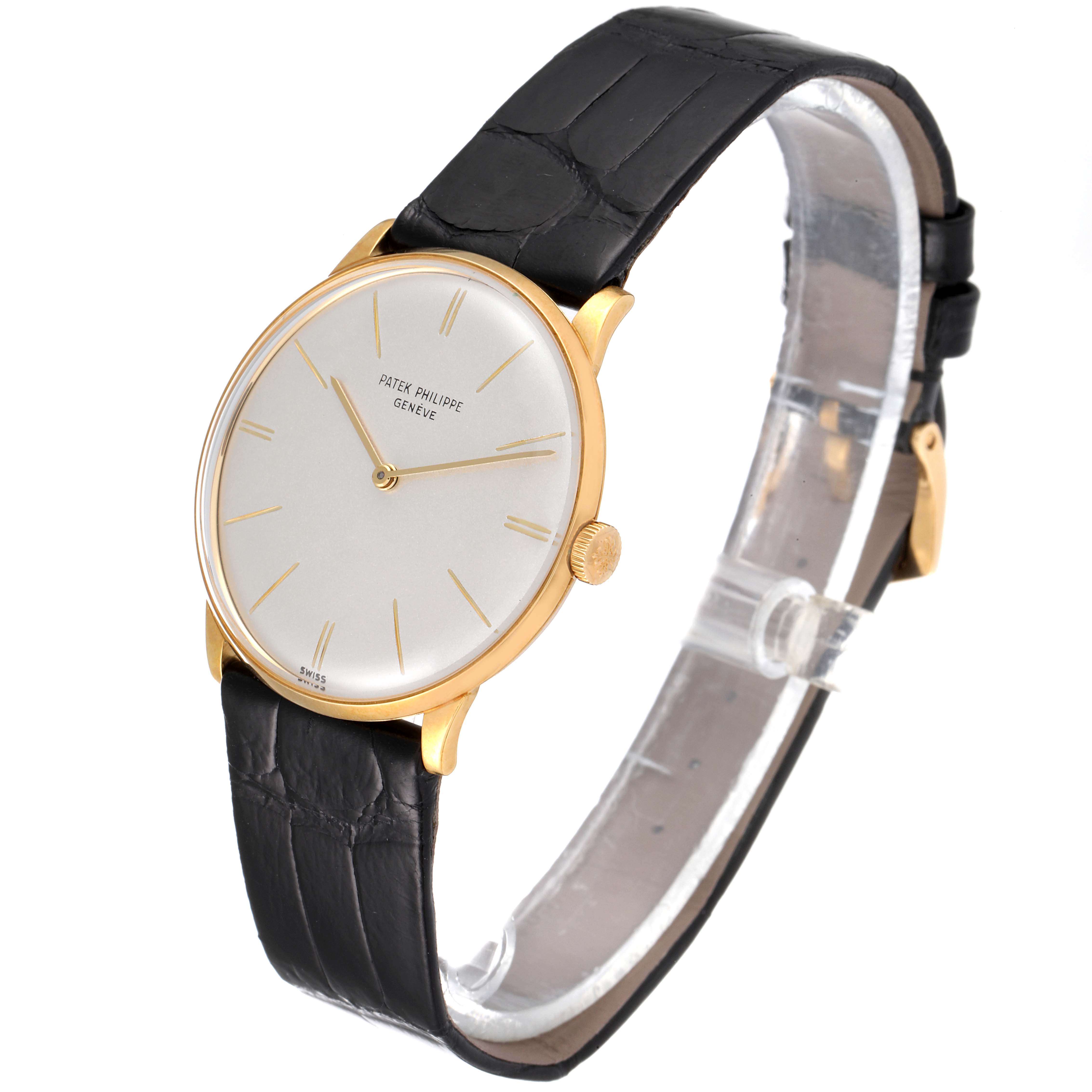 A side-angle view of the Vintage Patek Philippe watch shows its face, strap, and buckle.